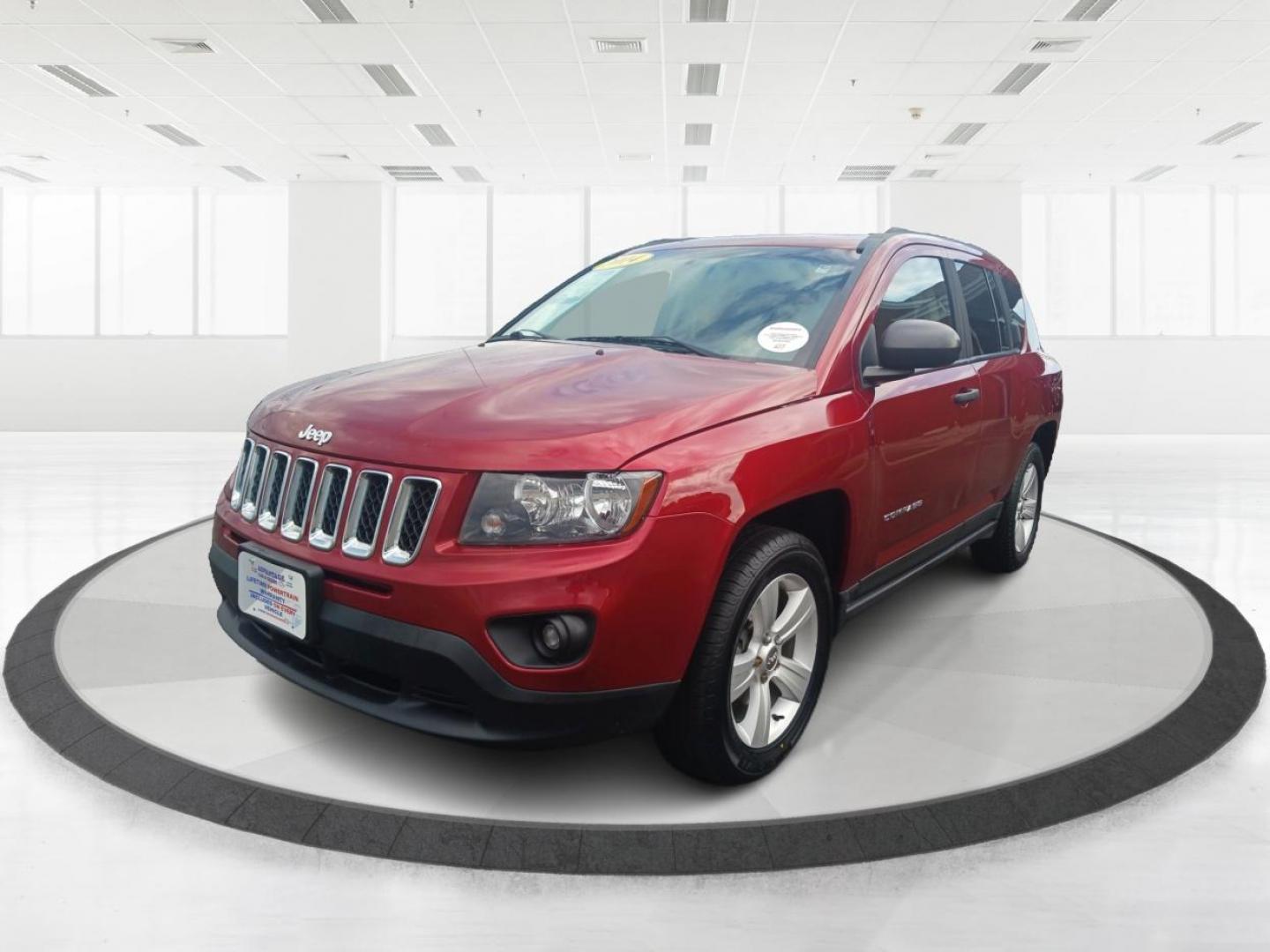 2014 Dp Cherry Red Crystal PC Jeep Compass Sport 4WD (1C4NJDBBXED) with an 2.4L L4 DOHC 16V engine, located at 1099 N County Rd 25A, OH, 45373, (937) 908-9800, 40.057079, -84.212883 - Photo#7