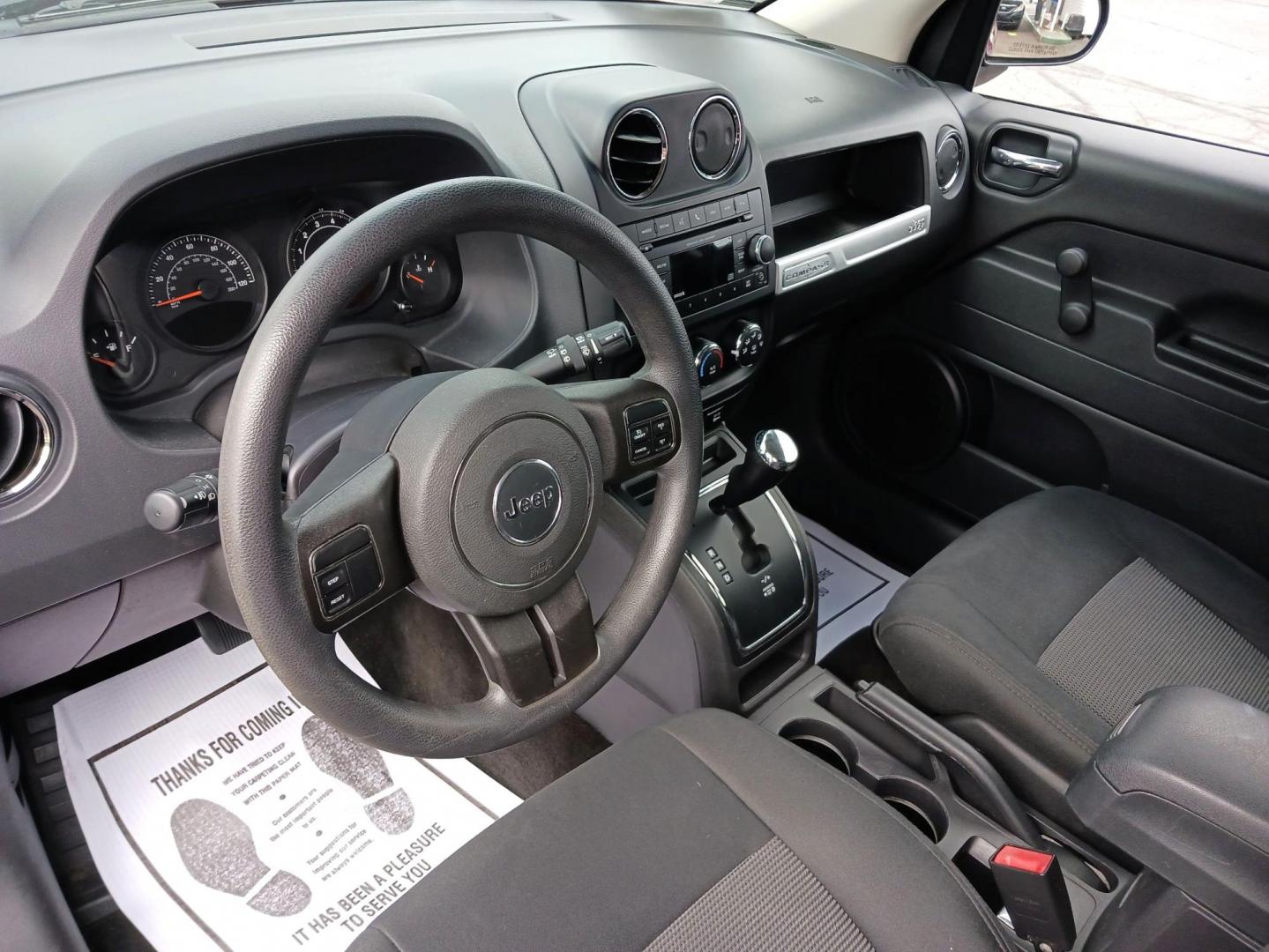 2014 Dp Cherry Red Crystal PC Jeep Compass Sport 4WD (1C4NJDBBXED) with an 2.4L L4 DOHC 16V engine, located at 1099 N County Rd 25A, OH, 45373, (937) 908-9800, 40.057079, -84.212883 - Photo#8