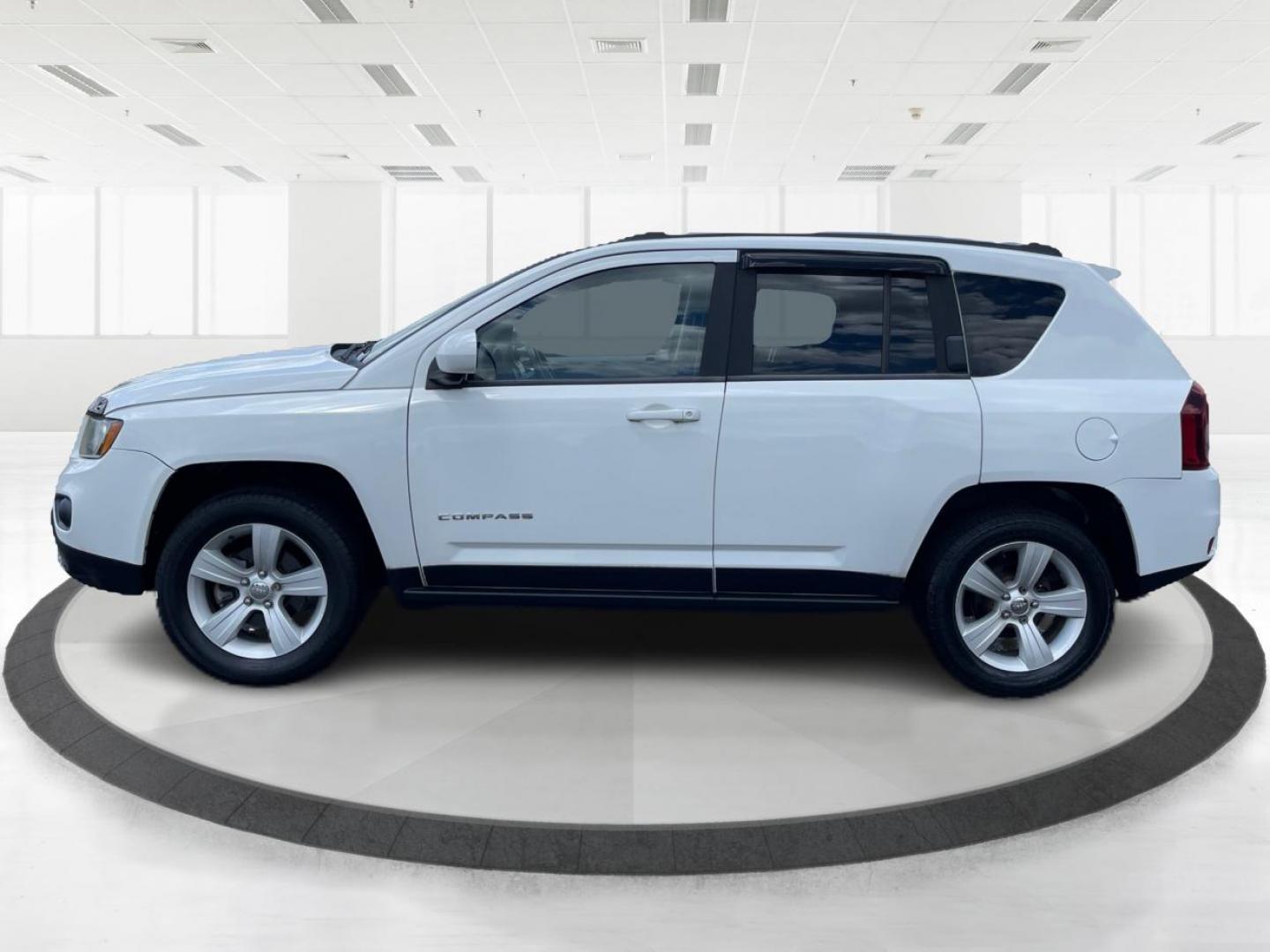 2014 Bright White Clearcoat Jeep Compass Latitude 4WD (1C4NJDEB8ED) with an 2.4L L4 DOHC 16V engine, Continuously Variable Transmission transmission, located at 1184 Kauffman Ave, Fairborn, OH, 45324, (937) 908-9800, 39.807365, -84.029114 - Photo#5