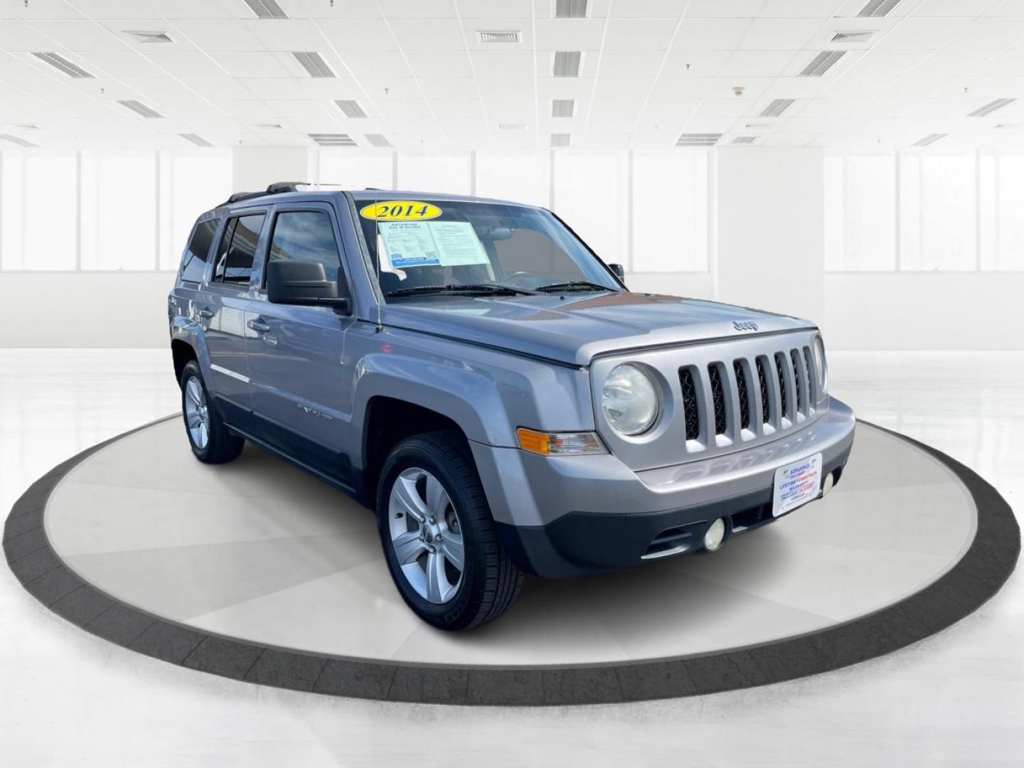 2014 Bright Silver Metallic CC Jeep Patriot Latitude 4WD (1C4NJRFB2ED) with an 2.4L L4 DOHC 16V engine, located at 1099 N County Rd 25A, OH, 45373, (937) 908-9800, 40.057079, -84.212883 - Photo#0