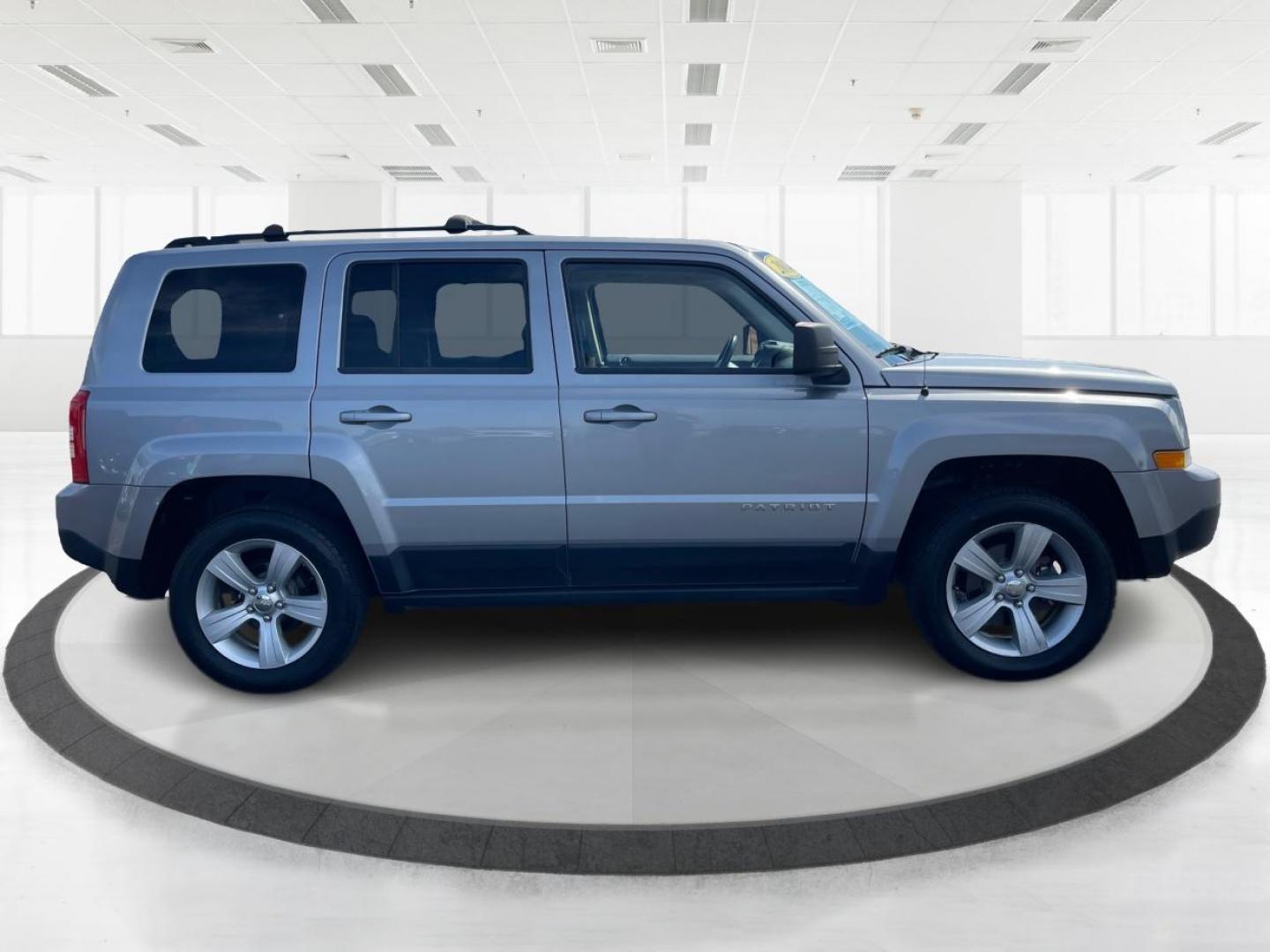 2014 Bright Silver Metallic CC Jeep Patriot Latitude 4WD (1C4NJRFB2ED) with an 2.4L L4 DOHC 16V engine, located at 1099 N County Rd 25A, OH, 45373, (937) 908-9800, 40.057079, -84.212883 - Photo#1