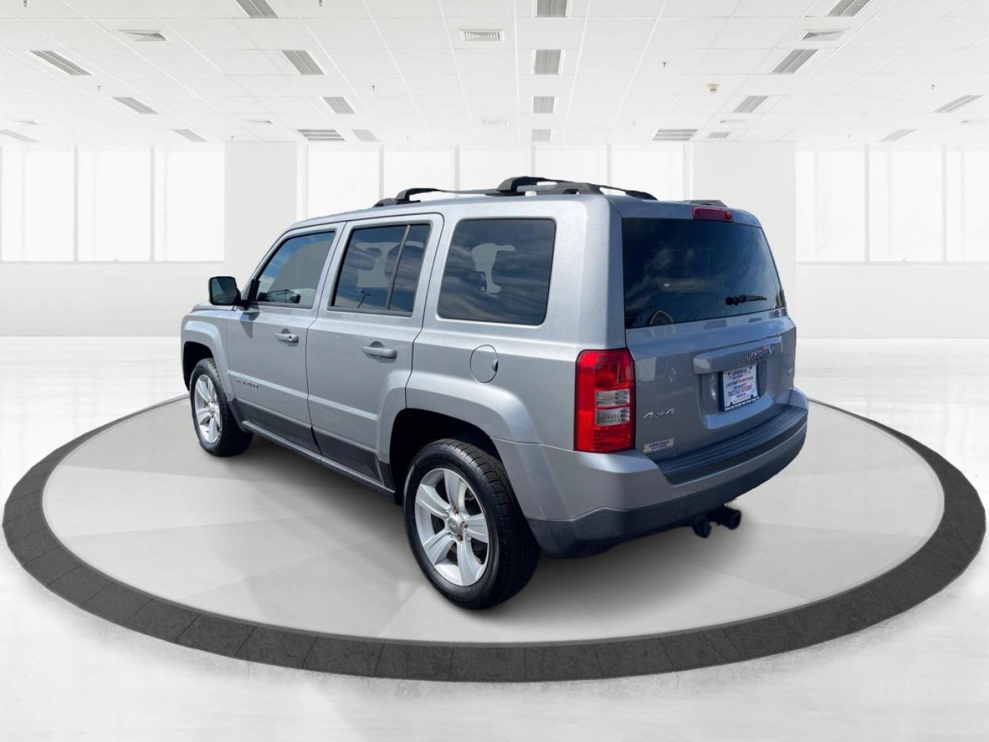 2014 Bright Silver Metallic CC Jeep Patriot Latitude 4WD (1C4NJRFB2ED) with an 2.4L L4 DOHC 16V engine, located at 1099 N County Rd 25A, OH, 45373, (937) 908-9800, 40.057079, -84.212883 - Photo#4