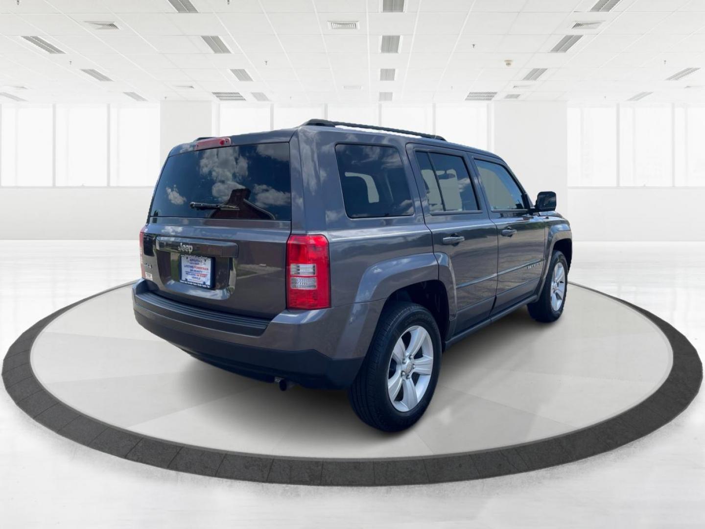 2014 Granite Crystal Met CC Jeep Patriot Sport 4WD (1C4NJRBB8ED) with an 2.4L L4 DOHC 16V engine, located at 401 Woodman Dr, Riverside, OH, 45431, (937) 908-9800, 39.763779, -84.122063 - Photo#2