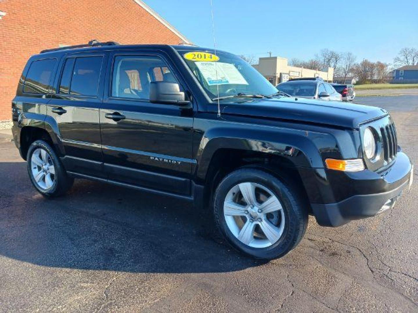 2014 Black Clearcoat Jeep Patriot Latitude 4WD (1C4NJRFB8ED) with an 2.4L L4 DOHC 16V engine, located at 401 Woodman Dr, Riverside, OH, 45431, (937) 908-9800, 39.763779, -84.122063 - Photo#0