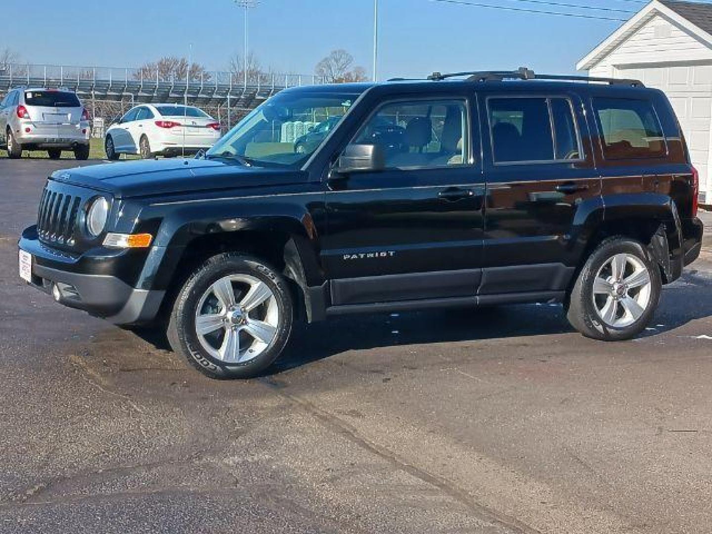 2014 Black Clearcoat Jeep Patriot Latitude 4WD (1C4NJRFB8ED) with an 2.4L L4 DOHC 16V engine, located at 401 Woodman Dr, Riverside, OH, 45431, (937) 908-9800, 39.763779, -84.122063 - Photo#2