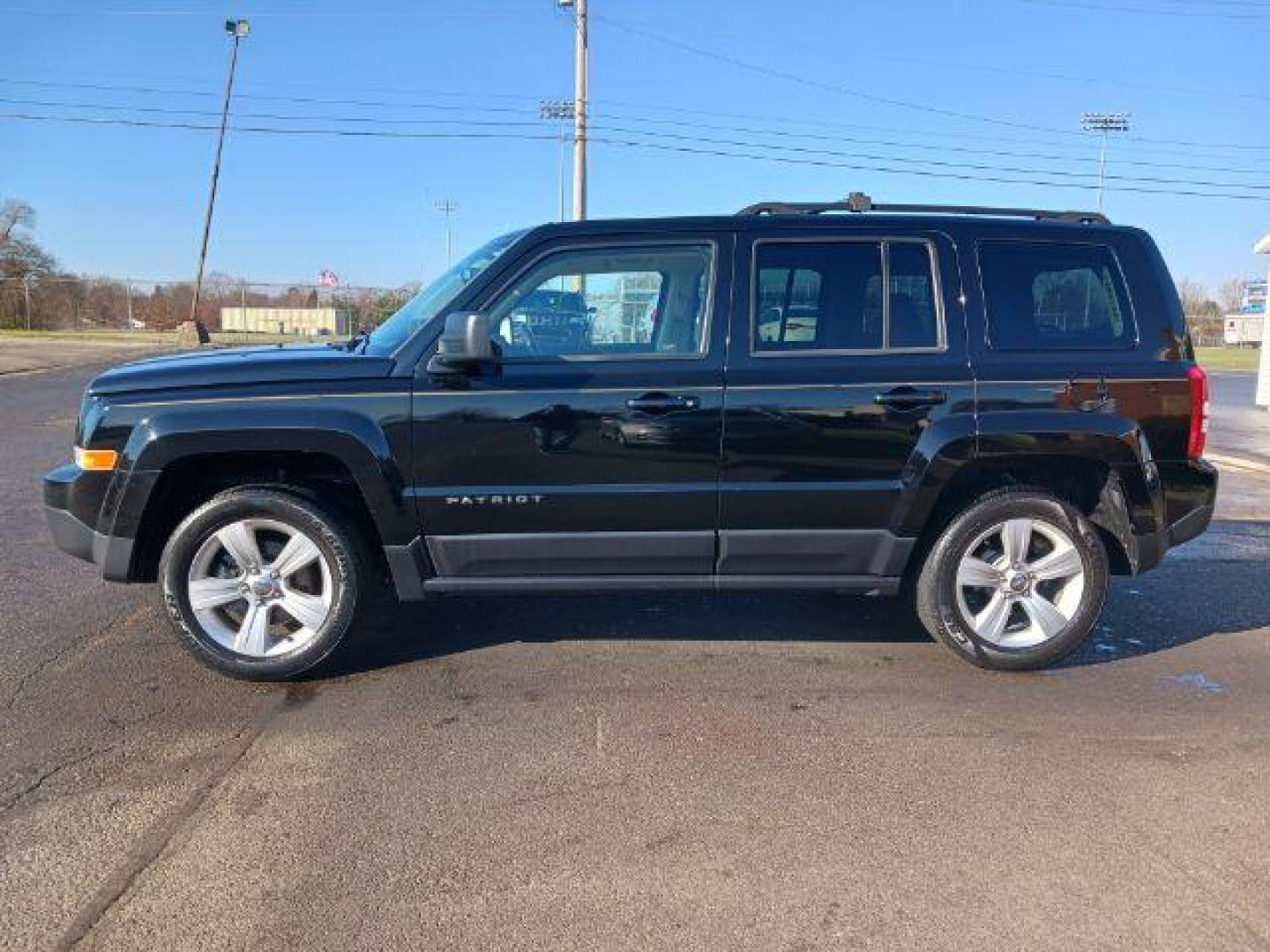 2014 Black Clearcoat Jeep Patriot Latitude 4WD (1C4NJRFB8ED) with an 2.4L L4 DOHC 16V engine, located at 401 Woodman Dr, Riverside, OH, 45431, (937) 908-9800, 39.763779, -84.122063 - Photo#3