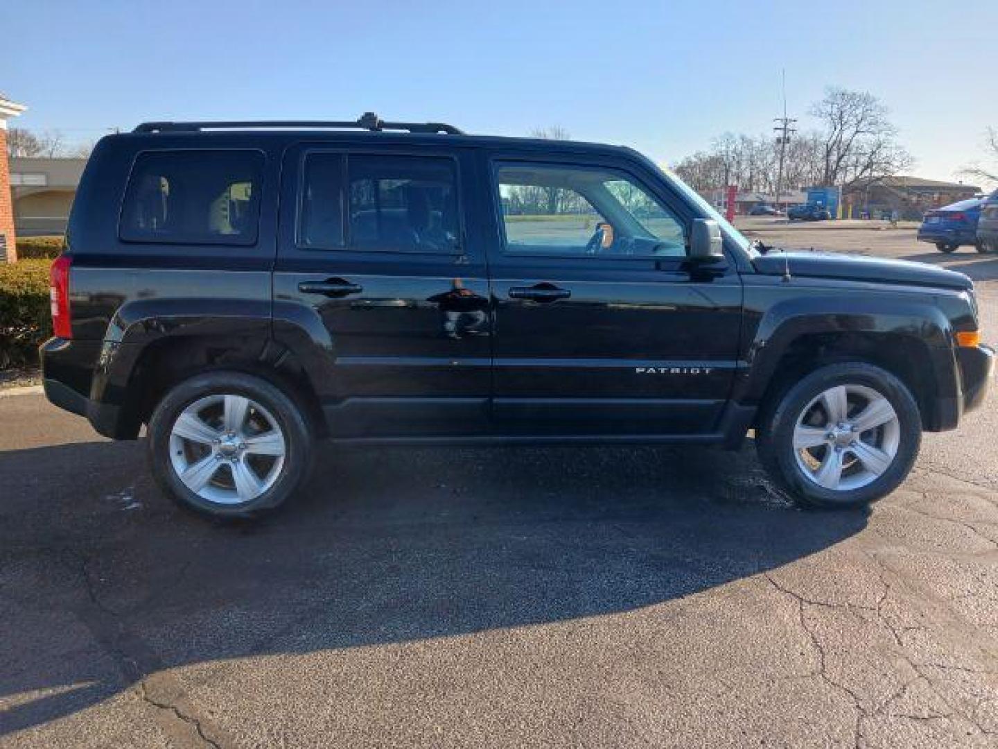 2014 Black Clearcoat Jeep Patriot Latitude 4WD (1C4NJRFB8ED) with an 2.4L L4 DOHC 16V engine, located at 401 Woodman Dr, Riverside, OH, 45431, (937) 908-9800, 39.763779, -84.122063 - Photo#4