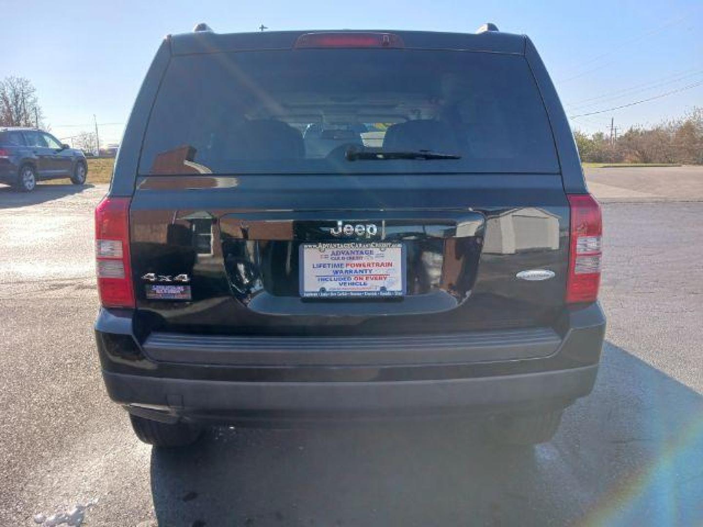 2014 Black Clearcoat Jeep Patriot Latitude 4WD (1C4NJRFB8ED) with an 2.4L L4 DOHC 16V engine, located at 401 Woodman Dr, Riverside, OH, 45431, (937) 908-9800, 39.763779, -84.122063 - Photo#5