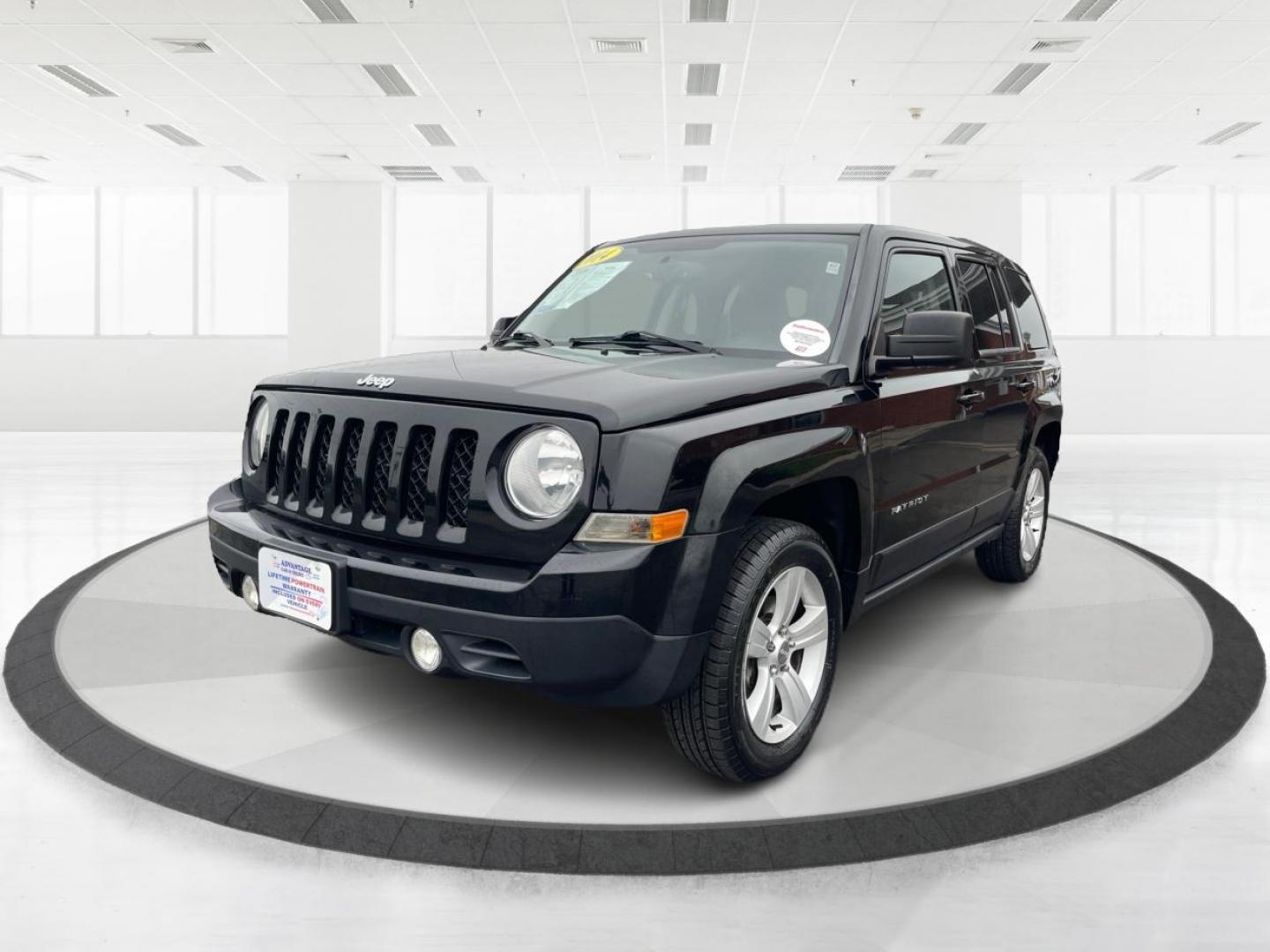 2014 Black Clearcoat Jeep Patriot Latitude 4WD (1C4NJRFB1ED) with an 2.4L L4 DOHC 16V engine, located at 4508 South Dixie Dr, Moraine, OH, 45439, (937) 908-9800, 39.690136, -84.216438 - Photo#7