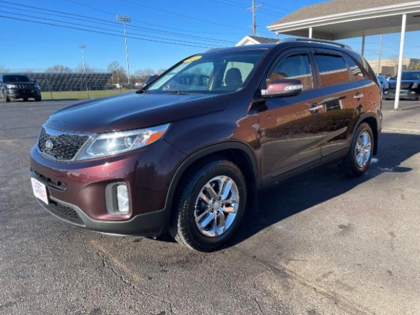 2014 Maroon Kia Sorento LX 2WD (5XYKT3A6XEG) with an 2.4L L4 DOHC 16V engine, 6-Speed Automatic transmission, located at 880 E. National Road, Vandalia, OH, 45377, (937) 908-9800, 39.892189, -84.181015 - Photo#1