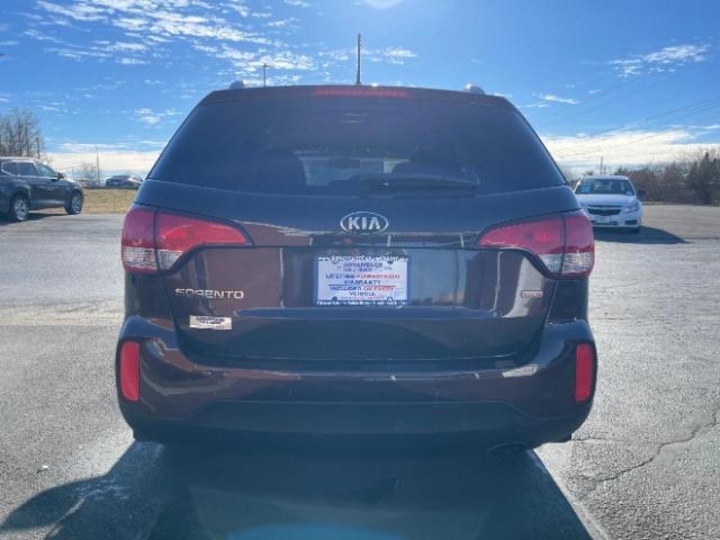 2014 Maroon Kia Sorento LX 2WD (5XYKT3A6XEG) with an 2.4L L4 DOHC 16V engine, 6-Speed Automatic transmission, located at 880 E. National Road, Vandalia, OH, 45377, (937) 908-9800, 39.892189, -84.181015 - Photo#4