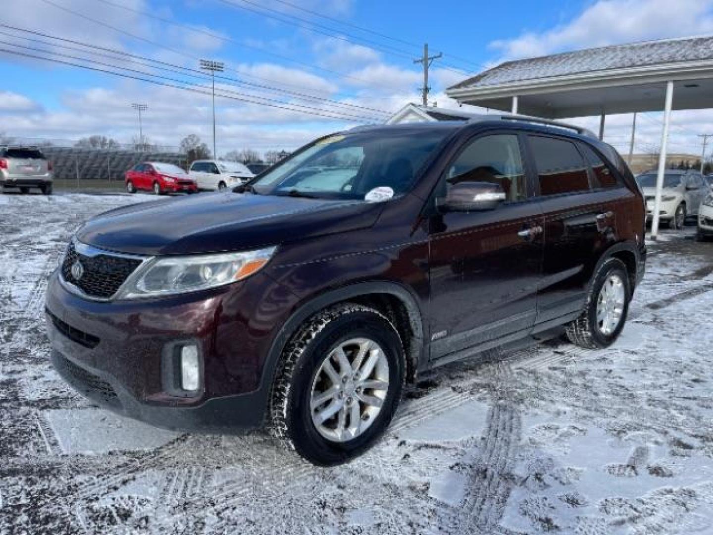 2014 Dark Cherry Kia Sorento LX AWD (5XYKTCA63EG) with an 2.4L L4 DOHC 16V engine, 6-Speed Automatic transmission, located at 1230 East Main St, Xenia, OH, 45385, (937) 908-9800, 39.687321, -83.910294 - Photo#1