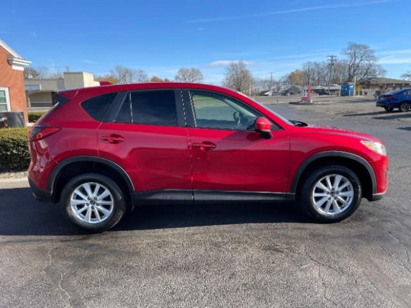 2014 Soul Red Metallic Mazda CX-5 Sport AT (JM3KE2BE7E0) with an 2.0L L4 DOHC 16V engine, 6-Speed Automatic transmission, located at 1230 East Main St, Xenia, OH, 45385, (937) 908-9800, 39.687321, -83.910294 - Photo#4