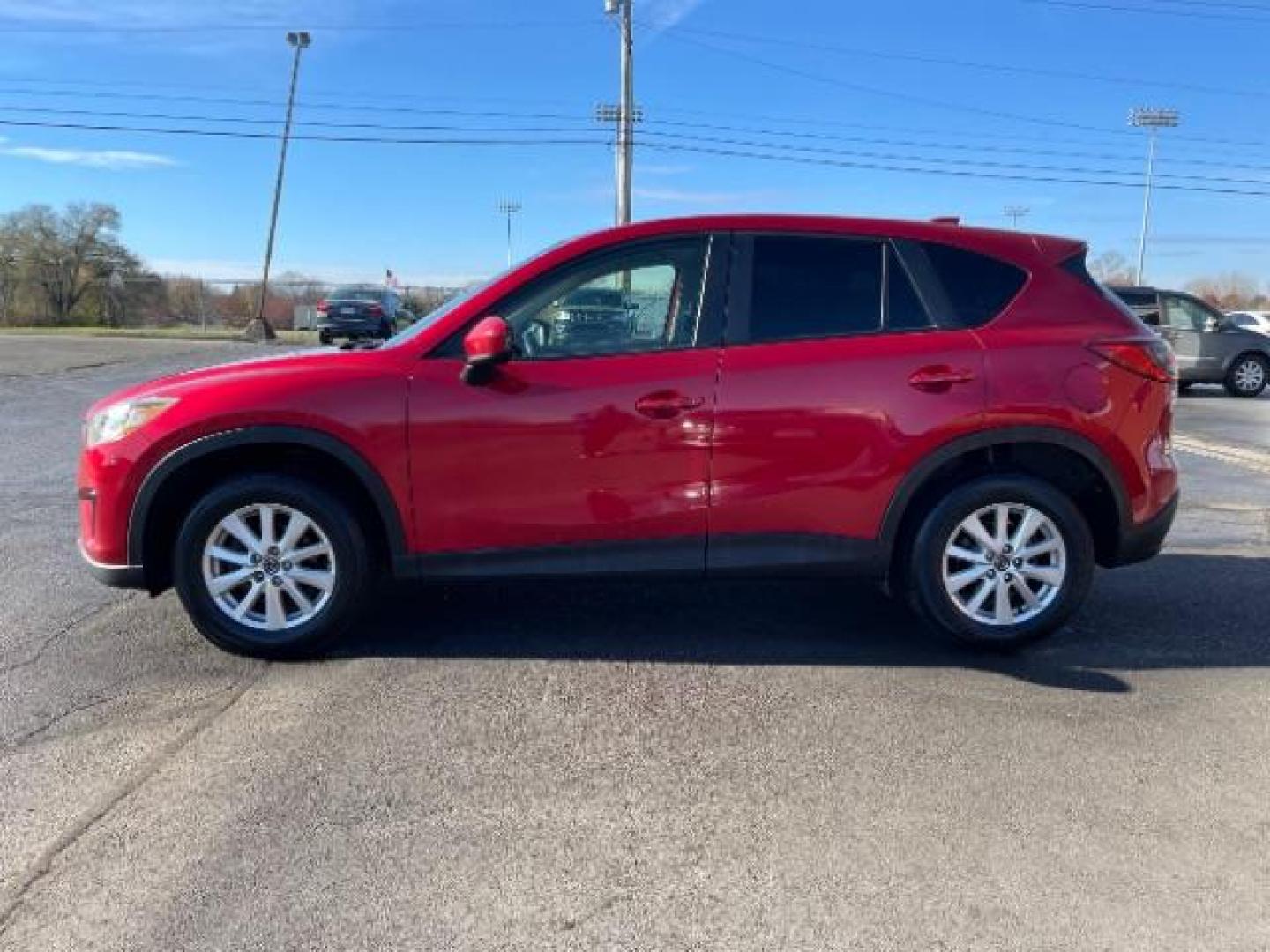 2014 Soul Red Metallic Mazda CX-5 Sport AT (JM3KE2BE7E0) with an 2.0L L4 DOHC 16V engine, 6-Speed Automatic transmission, located at 1230 East Main St, Xenia, OH, 45385, (937) 908-9800, 39.687321, -83.910294 - Photo#5