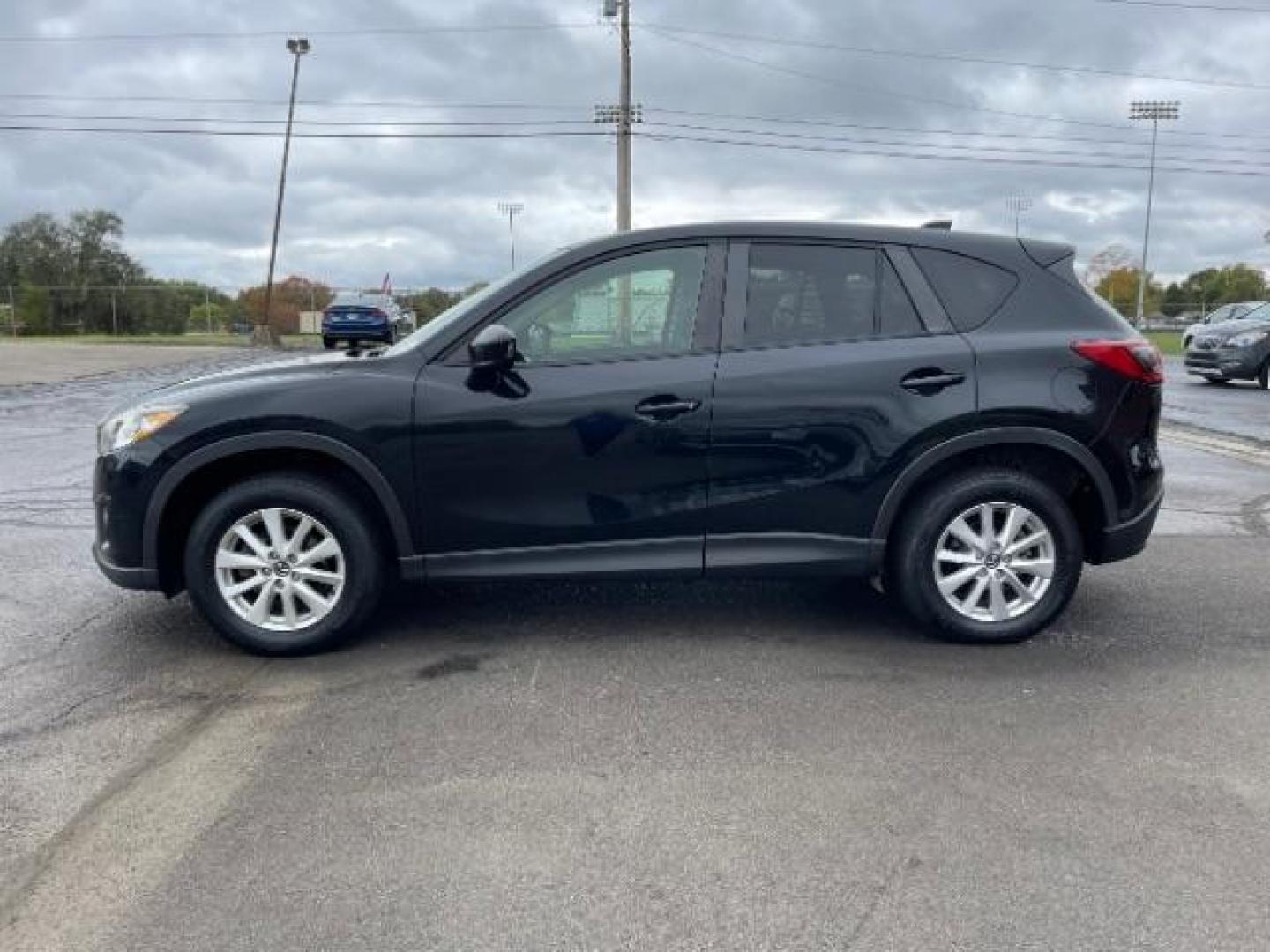 2014 Jet Black Mica Mazda CX-5 Touring AWD (JM3KE4CY2E0) with an 2.5L L4 DOHC 16V engine, 6-Speed Automatic transmission, located at 1230 East Main St, Xenia, OH, 45385, (937) 908-9800, 39.687321, -83.910294 - Photo#4