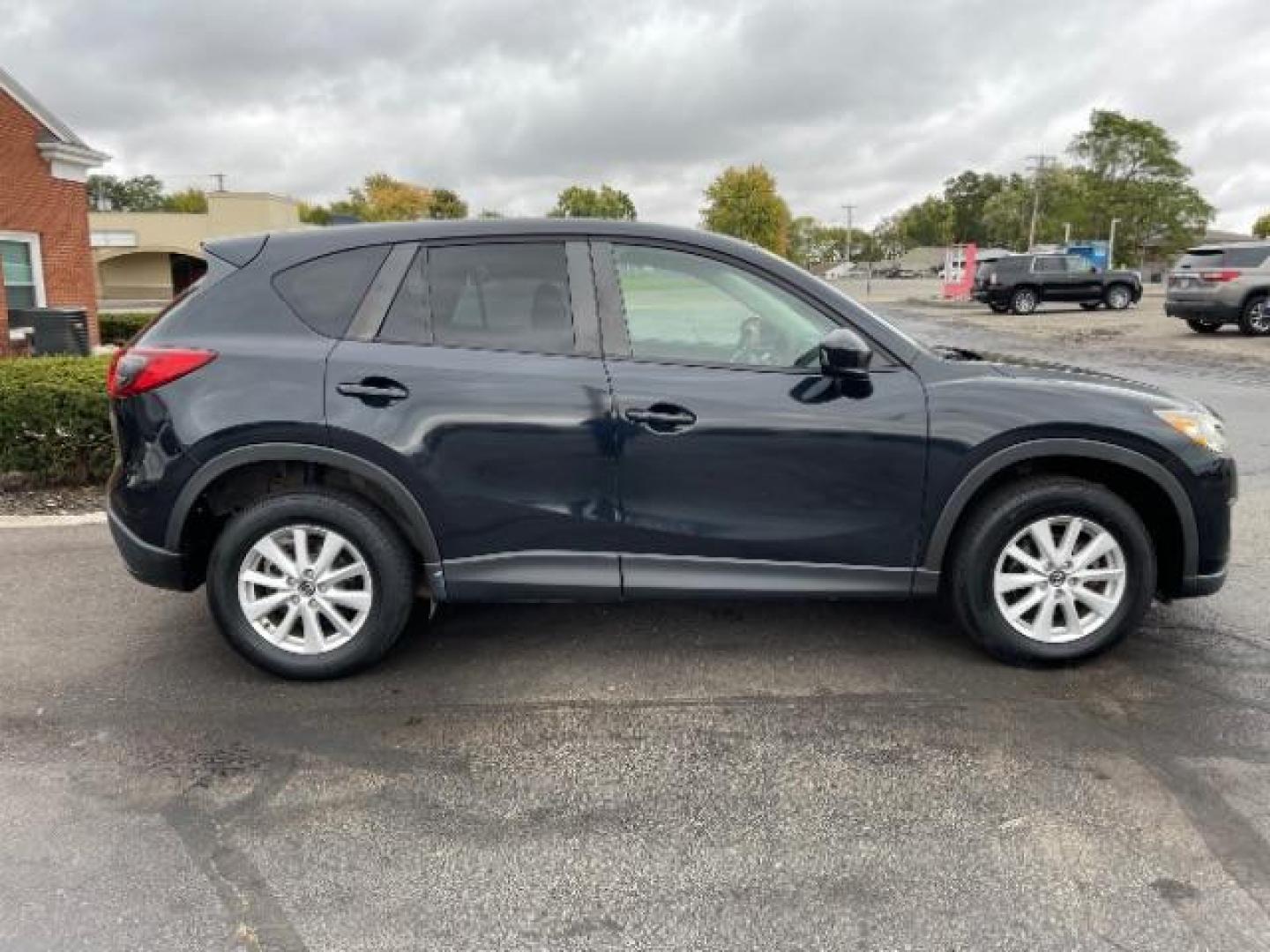 2014 Jet Black Mica Mazda CX-5 Touring AWD (JM3KE4CY2E0) with an 2.5L L4 DOHC 16V engine, 6-Speed Automatic transmission, located at 1230 East Main St, Xenia, OH, 45385, (937) 908-9800, 39.687321, -83.910294 - Photo#5