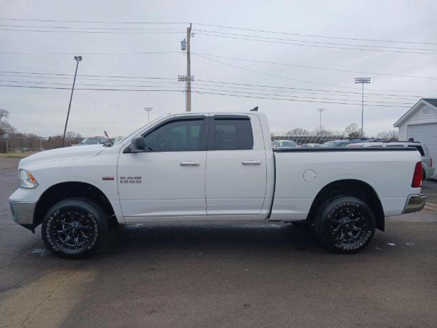 2014 Bright White Clearcoat RAM 1500 SLT Quad Cab 4WD (1C6RR7GT9ES) with an 5.7L V8 OHV 16V engine, 8-Speed Automatic transmission, located at 1184 Kauffman Ave, Fairborn, OH, 45324, (937) 908-9800, 39.807365, -84.029114 - Photo#3