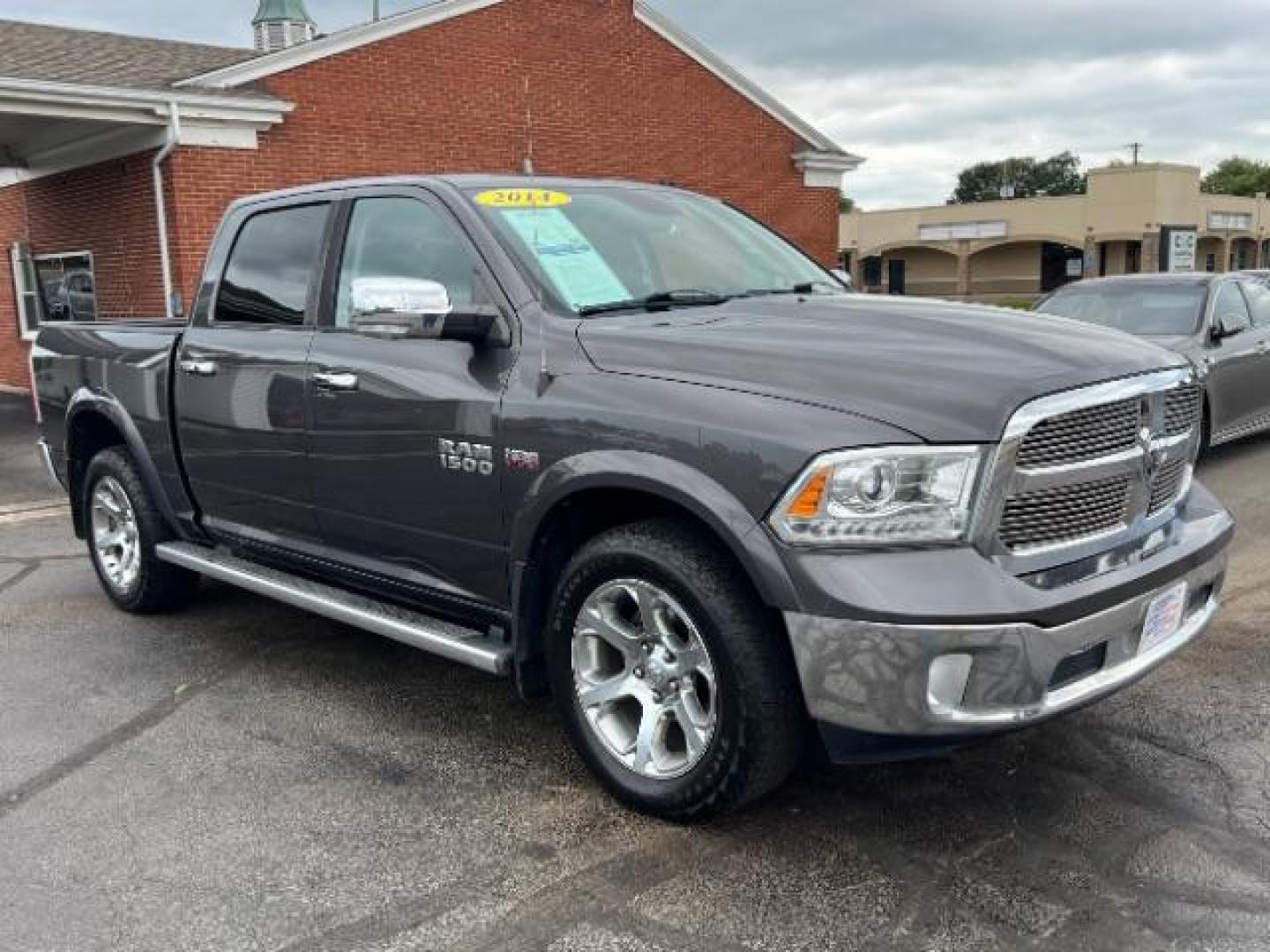 2014 Granite Crystal Met CC RAM 1500 Laramie Crew Cab SWB 4WD (1C6RR7NTXES) with an 5.7L V8 OHV 16V engine, 8-Speed Automatic transmission, located at 1951 S Dayton Lakeview Rd., New Carlisle, OH, 45344, (937) 908-9800, 39.890999, -84.050255 - Photo#0