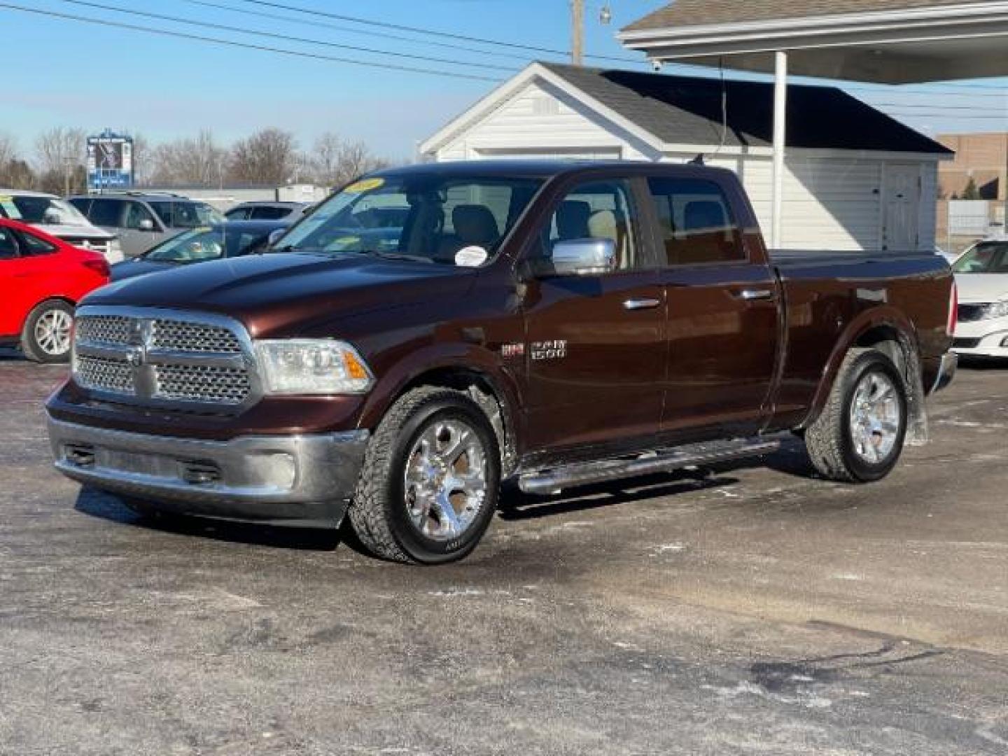 2014 Western Brown RAM 1500 Laramie Crew Cab LWB 4WD (1C6RR7VT1ES) with an 5.7L V8 OHV 16V engine, 8-Speed Automatic transmission, located at 1099 N County Rd 25A, OH, 45373, (937) 908-9800, 40.057079, -84.212883 - Photo#1