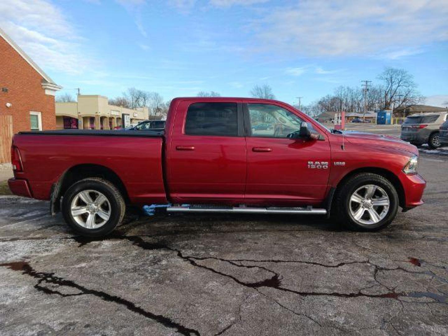 2014 Dp Cherry Red Crystal PC RAM 1500 Sport Crew Cab LWB 4WD (1C6RR7UT5ES) with an 5.7L V8 OHV 16V engine, 8-Speed Automatic transmission, located at 1230 East Main St, Xenia, OH, 45385, (937) 908-9800, 39.687321, -83.910294 - Photo#4