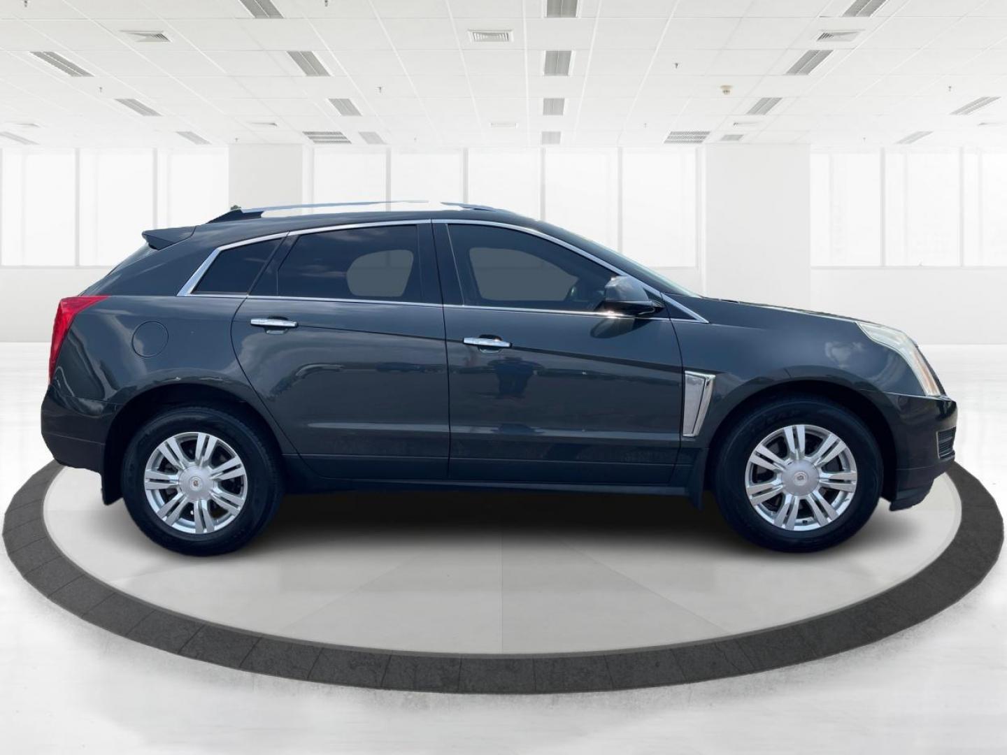 2015 Graphite Metallic Cadillac SRX Luxury Collection AWD (3GYFNEE31FS) with an 3.6L V6 DOHC 24V FFV engine, 6-Speed Automatic transmission, located at 1099 N County Rd 25A, OH, 45373, (937) 908-9800, 40.057079, -84.212883 - Photo#1