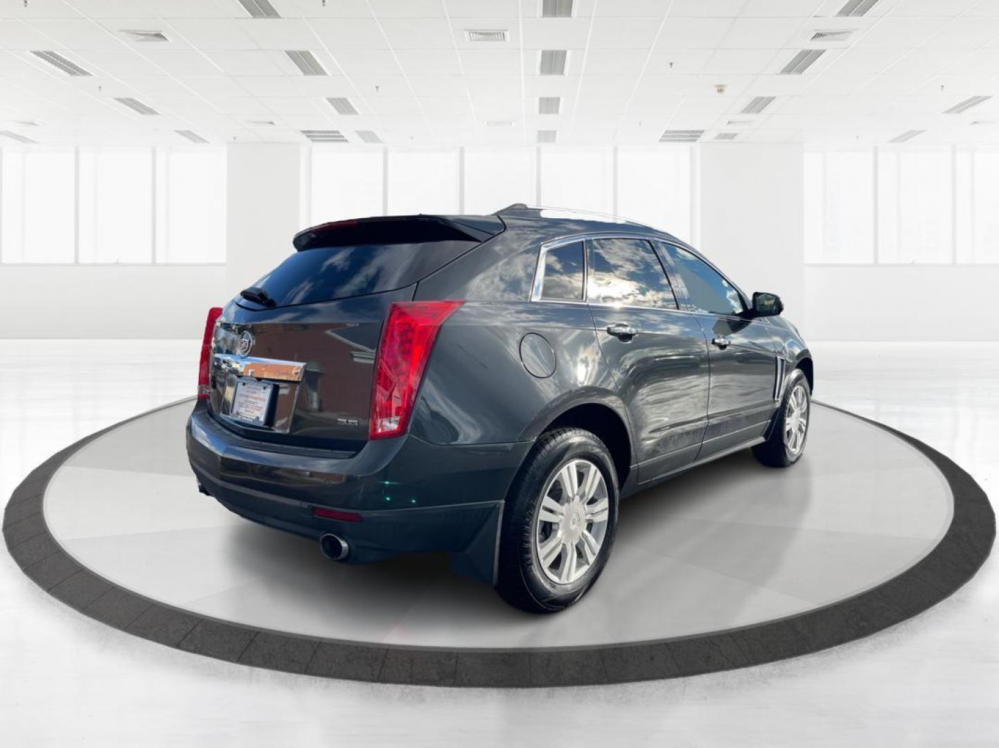 2015 Graphite Metallic Cadillac SRX Luxury Collection FWD (3GYFNBE3XFS) with an 3.6L V6 DOHC 24V FFV engine, 6-Speed Automatic transmission, located at 880 E. National Road, Vandalia, OH, 45377, (937) 908-9800, 39.891918, -84.183594 - 2015 Cadillac SRX Luxury Collection FWD - Photo#2