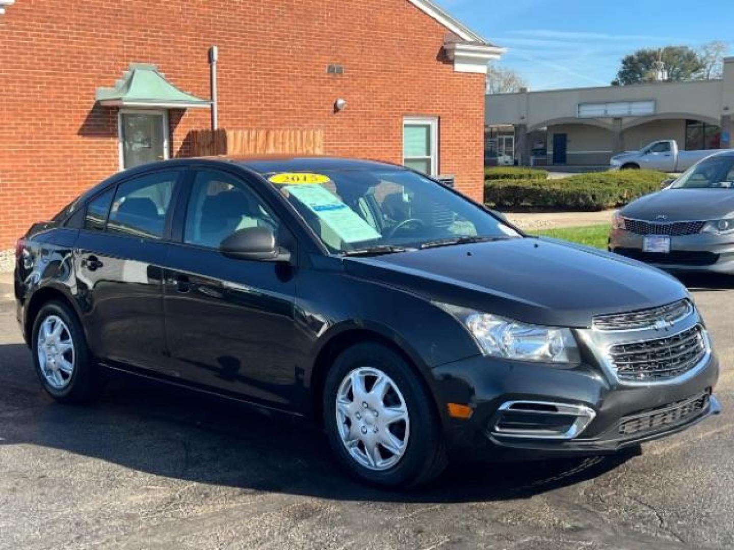 2015 Black Granite Metallic Chevrolet Cruze LS Auto (1G1PA5SHXF7) with an 1.8L L4 DOHC 16V FFV engine, 6-Speed Automatic transmission, located at 4508 South Dixie Dr, Moraine, OH, 45439, (937) 908-9800, 39.690136, -84.216438 - Photo#0