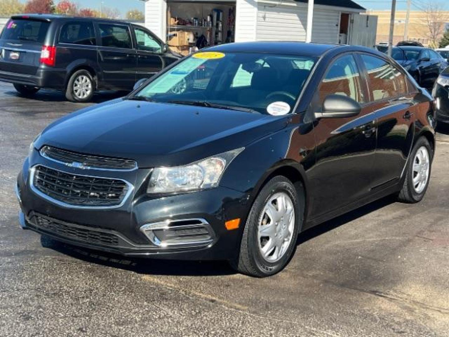 2015 Black Granite Metallic Chevrolet Cruze LS Auto (1G1PA5SHXF7) with an 1.8L L4 DOHC 16V FFV engine, 6-Speed Automatic transmission, located at 4508 South Dixie Dr, Moraine, OH, 45439, (937) 908-9800, 39.690136, -84.216438 - Photo#2