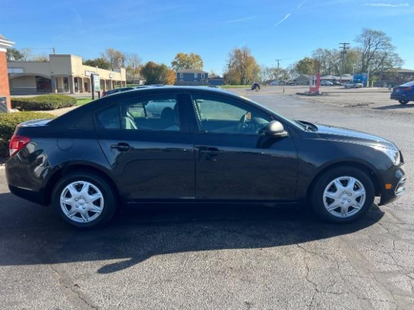 2015 Black Granite Metallic Chevrolet Cruze LS Auto (1G1PA5SHXF7) with an 1.8L L4 DOHC 16V FFV engine, 6-Speed Automatic transmission, located at 4508 South Dixie Dr, Moraine, OH, 45439, (937) 908-9800, 39.690136, -84.216438 - Photo#5