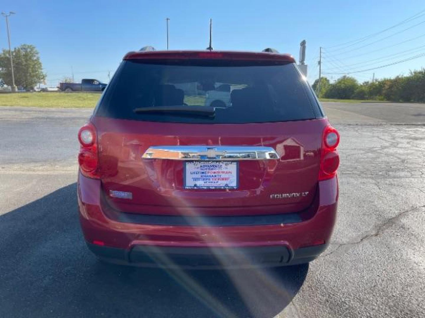 2015 Crystal Red Tintcoat Chevrolet Equinox 1LT 2WD (2GNALBEK3F1) with an 2.4L L4 DOHC 16V FFV engine, 6-Speed Automatic transmission, located at 880 E. National Road, Vandalia, OH, 45377, (937) 908-9800, 39.892189, -84.181015 - Photo#4