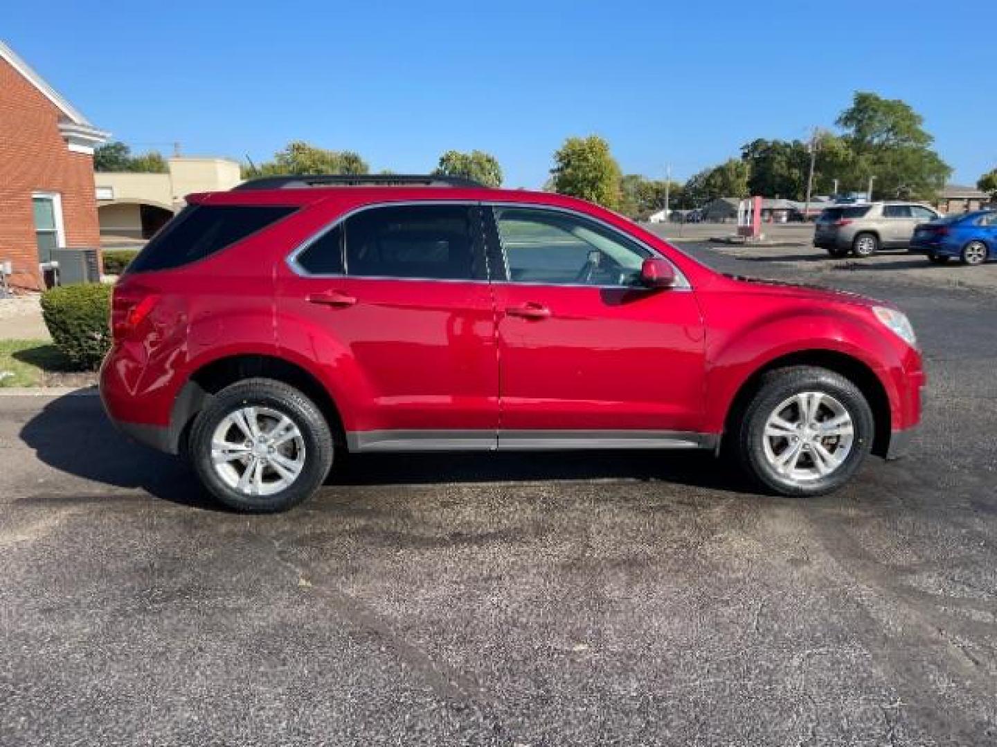 2015 Crystal Red Tintcoat Chevrolet Equinox 1LT 2WD (2GNALBEK3F1) with an 2.4L L4 DOHC 16V FFV engine, 6-Speed Automatic transmission, located at 880 E. National Road, Vandalia, OH, 45377, (937) 908-9800, 39.892189, -84.181015 - Photo#5