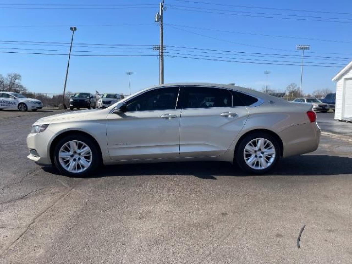 2015 Champagne Silver Metallic Chevrolet Impala LS (2G11Z5SL2F9) with an 2.5L L4 DOHC 16V engine, 6-Speed Automatic transmission, located at 1951 S Dayton Lakeview Rd., New Carlisle, OH, 45344, (937) 908-9800, 39.890999, -84.050255 - Photo#2