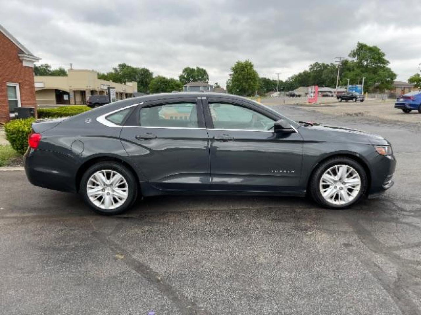 2015 Black Chevrolet Impala LS (2G11Z5SL6F9) with an 2.5L L4 DOHC 16V engine, 6-Speed Automatic transmission, located at 1184 Kauffman Ave, Fairborn, OH, 45324, (937) 908-9800, 39.807365, -84.029114 - Photo#3