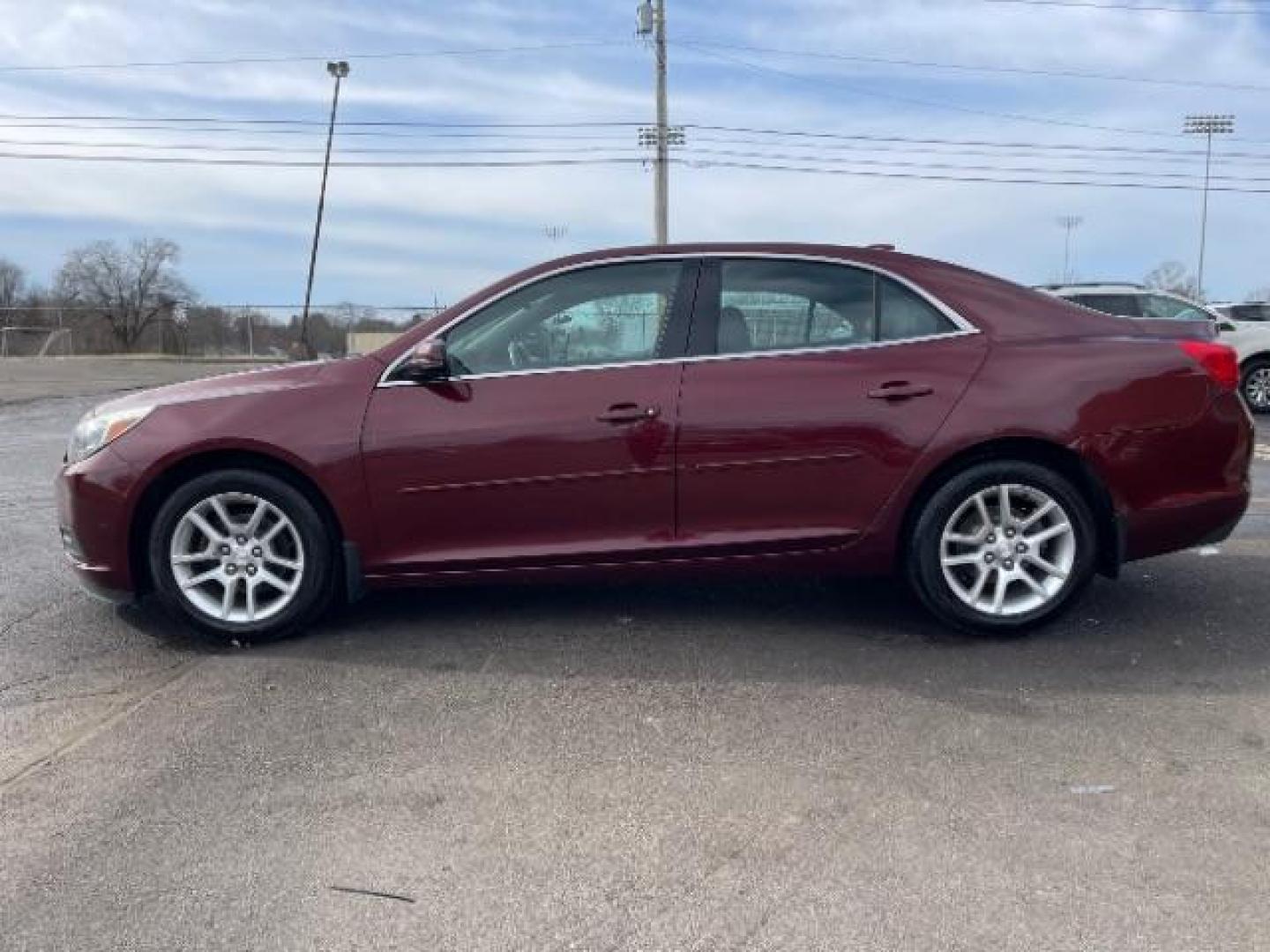 2015 Butte Red Metallic Chevrolet Malibu 1LT (1G11C5SL6FF) with an 2.5L L4 DOHC 16V engine, 6-Speed Automatic transmission, located at 1230 East Main St, Xenia, OH, 45385, (937) 908-9800, 39.687321, -83.910294 - Photo#2