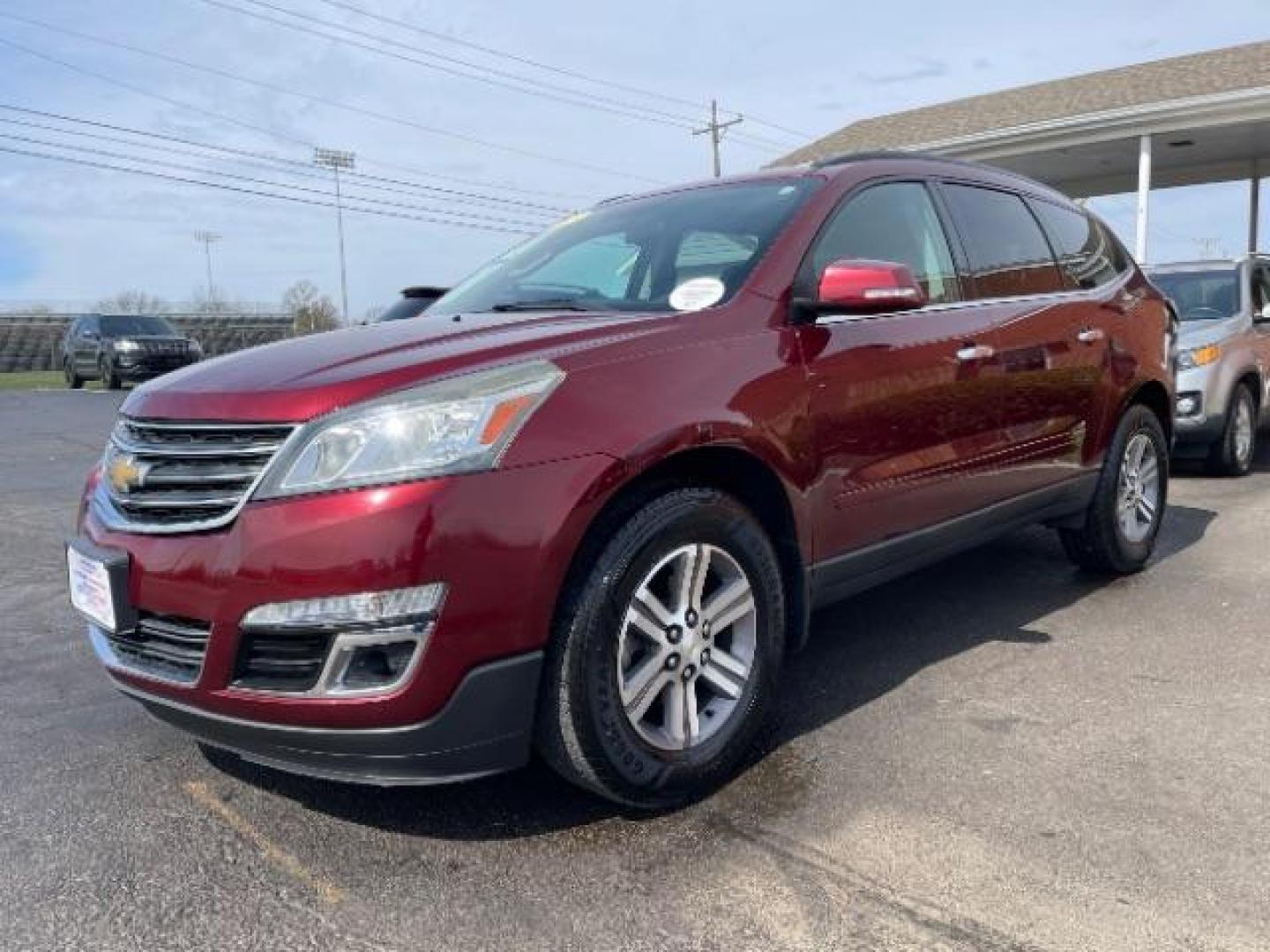 2015 Siren Red Tintcoat Chevrolet Traverse 2LT AWD (1GNKVHKD7FJ) with an 3.6L V6 DOHC 24V engine, 6-Speed Automatic transmission, located at 1184 Kauffman Ave, Fairborn, OH, 45324, (937) 908-9800, 39.807365, -84.029114 - Photo#1