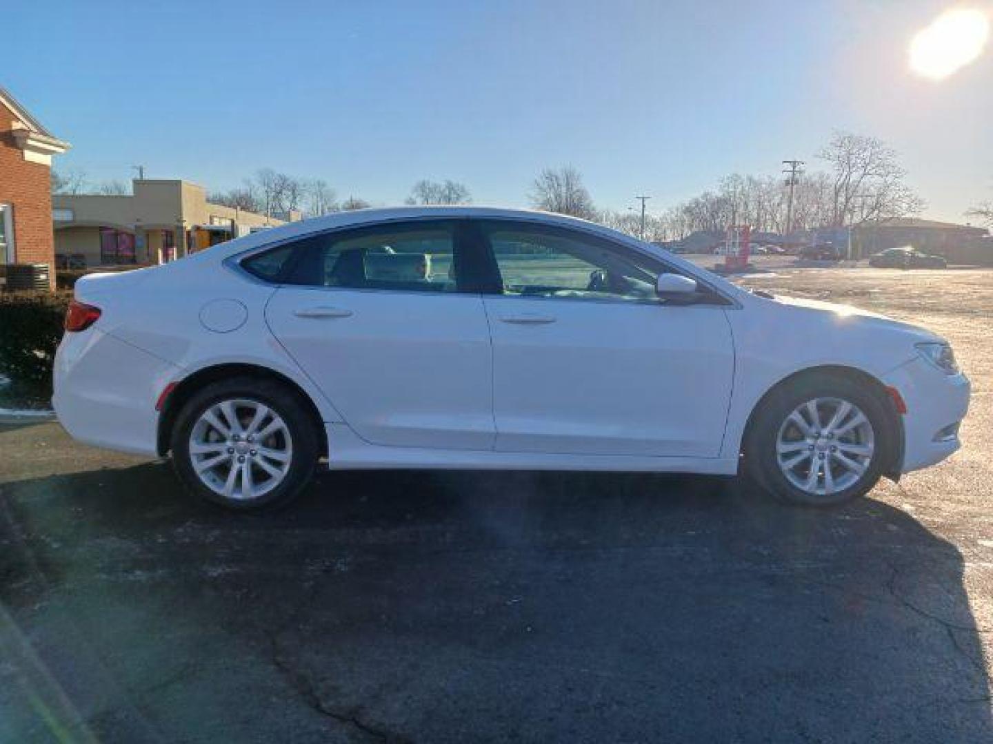 2015 Lunar White Tri-Coat Chrysler 200 Limited (1C3CCCAB9FN) with an 2.4L L4 DOHC 16V engine, 9-Speed Automatic transmission, located at 1099 N County Rd 25A, OH, 45373, (937) 908-9800, 40.057079, -84.212883 - Photo#4