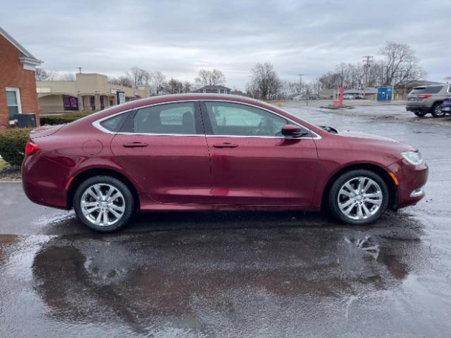 2015 Velvet Red Pearlcoat Chrysler 200 Limited (1C3CCCAB3FN) with an 2.4L L4 DOHC 16V engine, 9-Speed Automatic transmission, located at 401 Woodman Dr, Riverside, OH, 45431, (937) 908-9800, 39.763779, -84.122063 - Photo#4