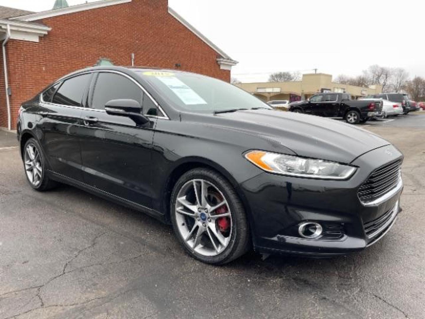 2015 Tuxedo Black Ford Fusion Titanium (3FA6P0K99FR) with an 2.0L L4 DOHC 16V engine, 6-Speed Automatic transmission, located at 401 Woodman Dr, Riverside, OH, 45431, (937) 908-9800, 39.763779, -84.122063 - Photo#0