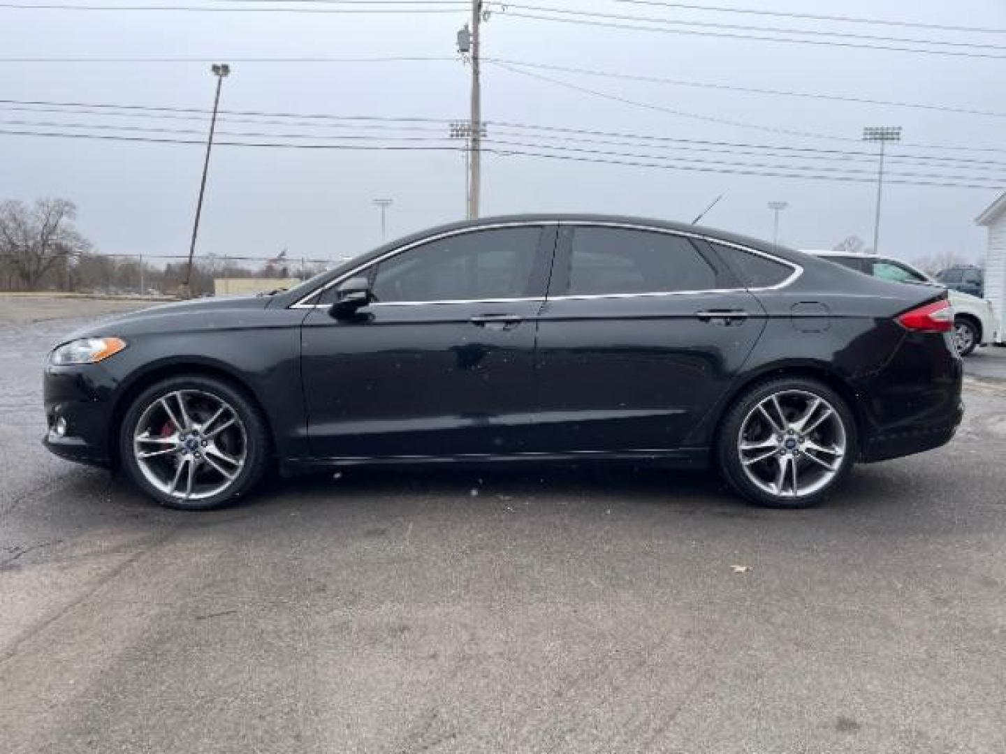 2015 Tuxedo Black Ford Fusion Titanium (3FA6P0K99FR) with an 2.0L L4 DOHC 16V engine, 6-Speed Automatic transmission, located at 401 Woodman Dr, Riverside, OH, 45431, (937) 908-9800, 39.763779, -84.122063 - Photo#2