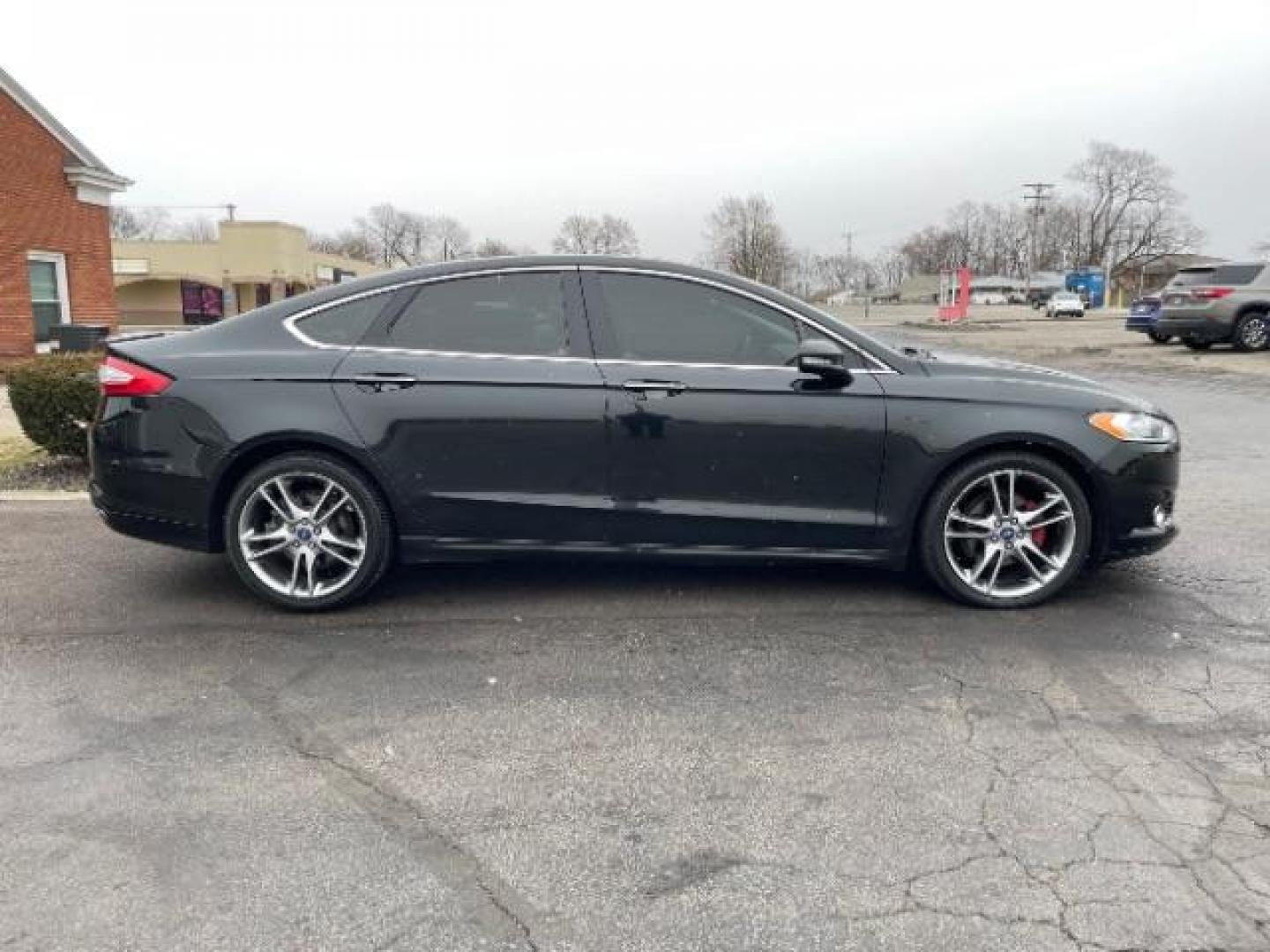 2015 Tuxedo Black Ford Fusion Titanium (3FA6P0K99FR) with an 2.0L L4 DOHC 16V engine, 6-Speed Automatic transmission, located at 401 Woodman Dr, Riverside, OH, 45431, (937) 908-9800, 39.763779, -84.122063 - Photo#3