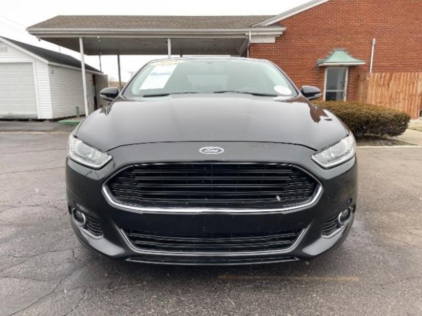 2015 Tuxedo Black Ford Fusion Titanium (3FA6P0K99FR) with an 2.0L L4 DOHC 16V engine, 6-Speed Automatic transmission, located at 401 Woodman Dr, Riverside, OH, 45431, (937) 908-9800, 39.763779, -84.122063 - Photo#4