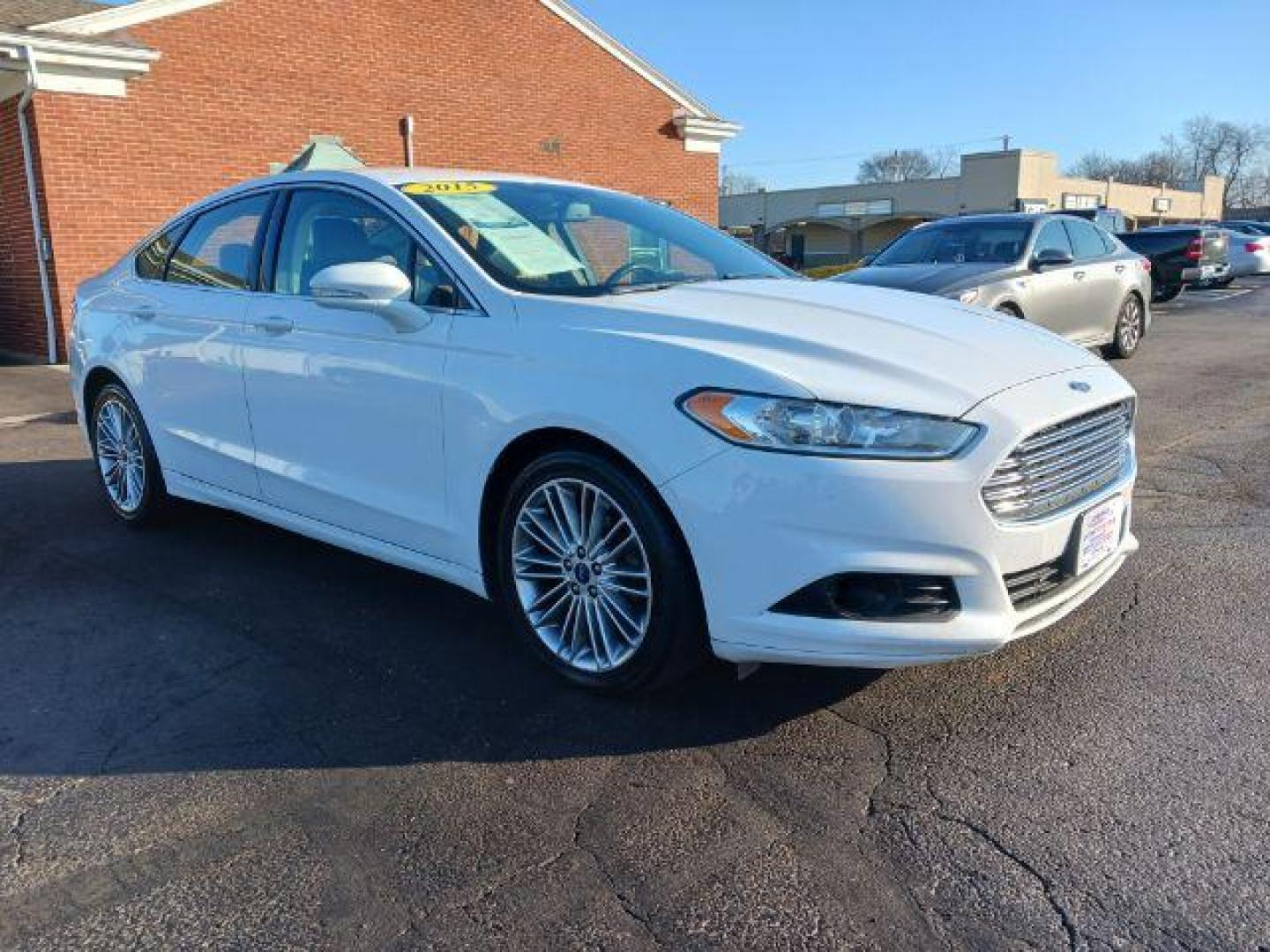 2015 White Platinum Met TC Ford Fusion SE (3FA6P0HD5FR) with an 1.5L L4 DOHC 16V engine, 6-Speed Automatic transmission, located at 1099 N County Rd 25A, OH, 45373, (937) 908-9800, 40.057079, -84.212883 - Photo#0