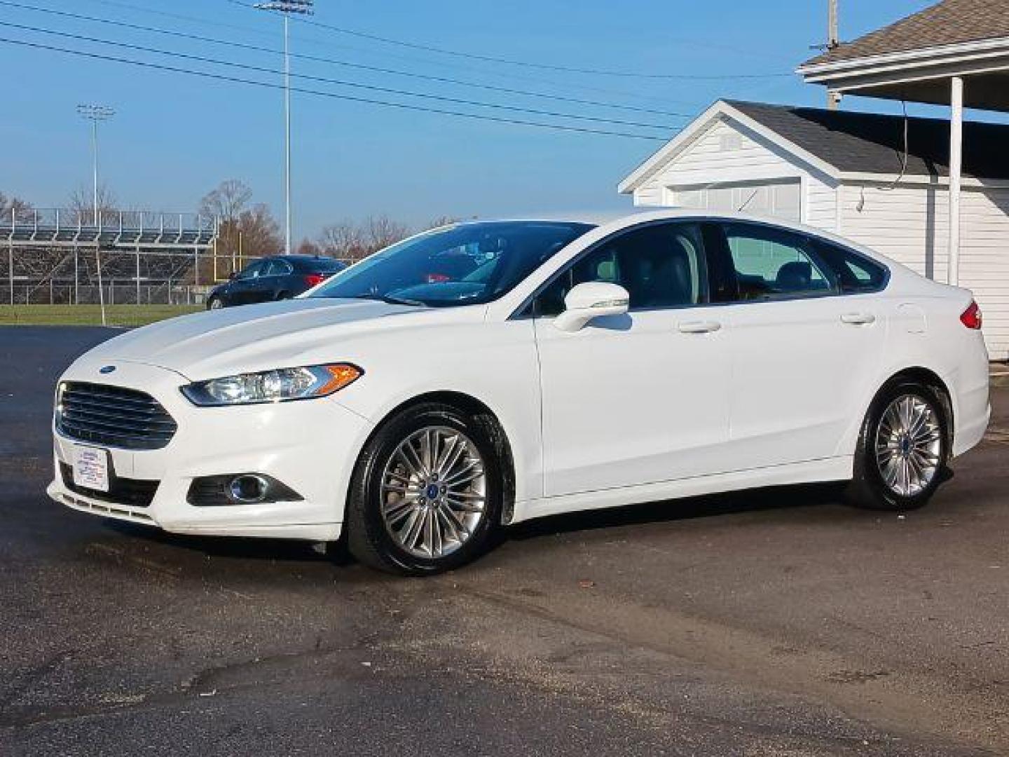 2015 White Platinum Met TC Ford Fusion SE (3FA6P0HD5FR) with an 1.5L L4 DOHC 16V engine, 6-Speed Automatic transmission, located at 1099 N County Rd 25A, OH, 45373, (937) 908-9800, 40.057079, -84.212883 - Photo#2