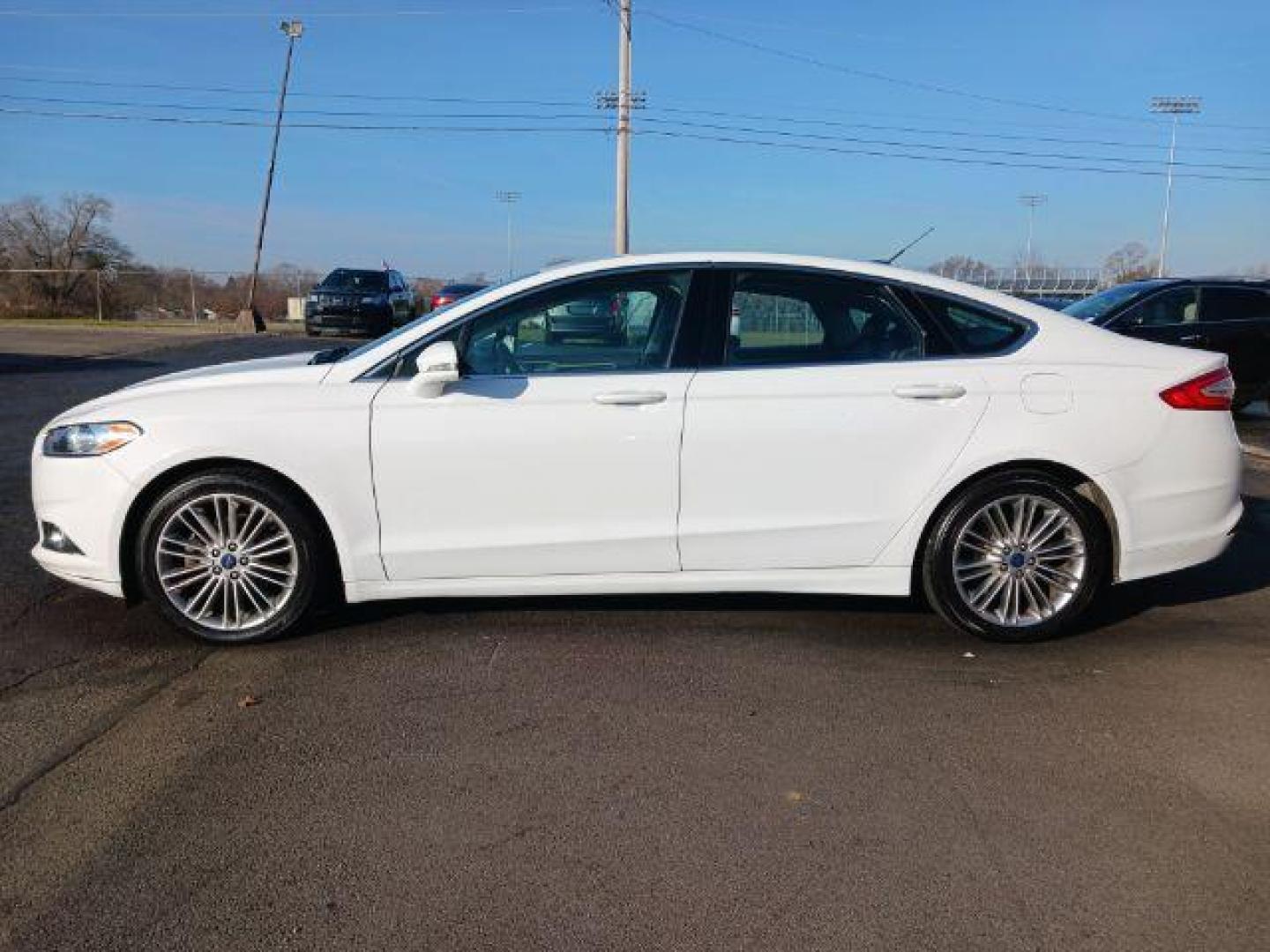 2015 White Platinum Met TC Ford Fusion SE (3FA6P0HD5FR) with an 1.5L L4 DOHC 16V engine, 6-Speed Automatic transmission, located at 1099 N County Rd 25A, OH, 45373, (937) 908-9800, 40.057079, -84.212883 - Photo#3