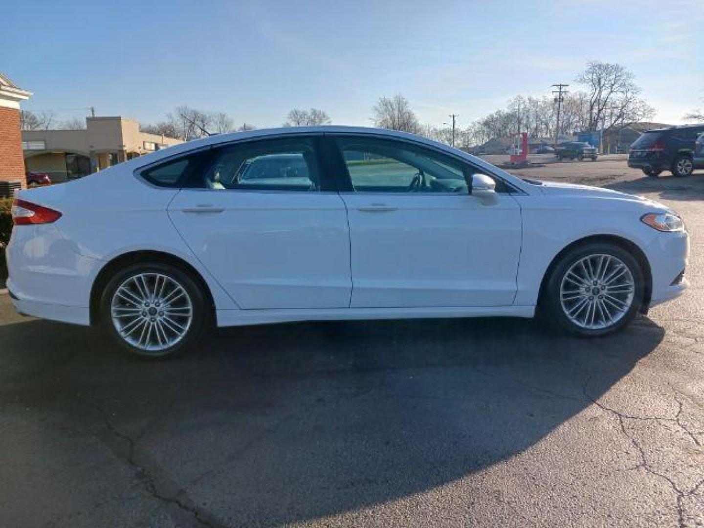 2015 White Platinum Met TC Ford Fusion SE (3FA6P0HD5FR) with an 1.5L L4 DOHC 16V engine, 6-Speed Automatic transmission, located at 1099 N County Rd 25A, OH, 45373, (937) 908-9800, 40.057079, -84.212883 - Photo#4