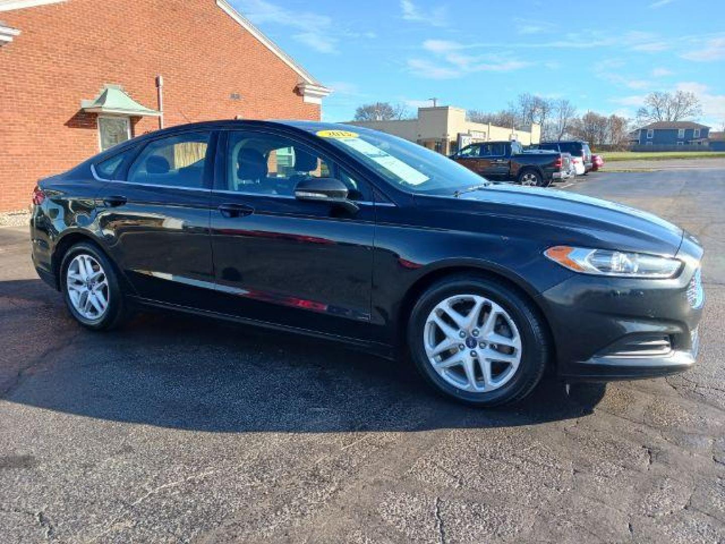 2015 Tuxedo Black Ford Fusion SE (3FA6P0H7XFR) with an 2.5L L4 DOHC 16V engine, 6-Speed Automatic transmission, located at 1230 East Main St, Xenia, OH, 45385, (937) 908-9800, 39.687321, -83.910294 - Photo#0