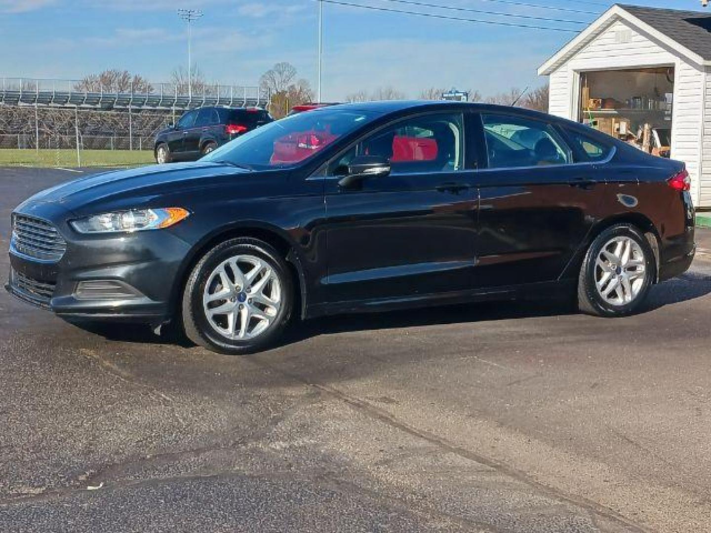 2015 Tuxedo Black Ford Fusion SE (3FA6P0H7XFR) with an 2.5L L4 DOHC 16V engine, 6-Speed Automatic transmission, located at 1230 East Main St, Xenia, OH, 45385, (937) 908-9800, 39.687321, -83.910294 - Photo#2