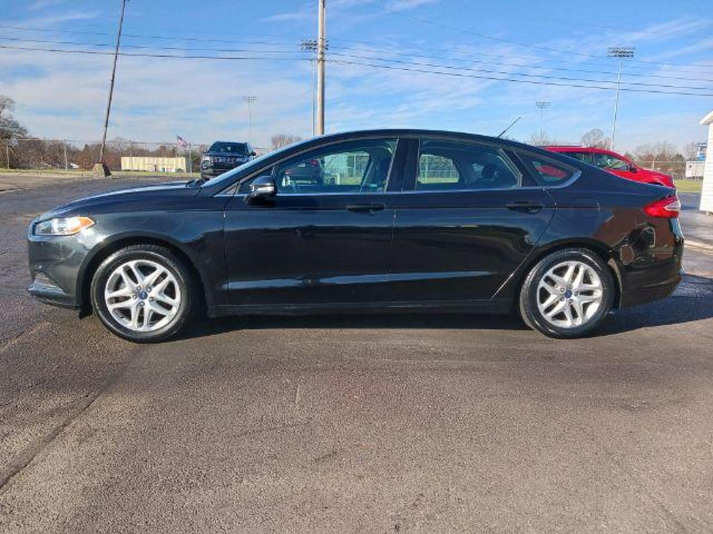 2015 Tuxedo Black Ford Fusion SE (3FA6P0H7XFR) with an 2.5L L4 DOHC 16V engine, 6-Speed Automatic transmission, located at 1230 East Main St, Xenia, OH, 45385, (937) 908-9800, 39.687321, -83.910294 - Photo#3