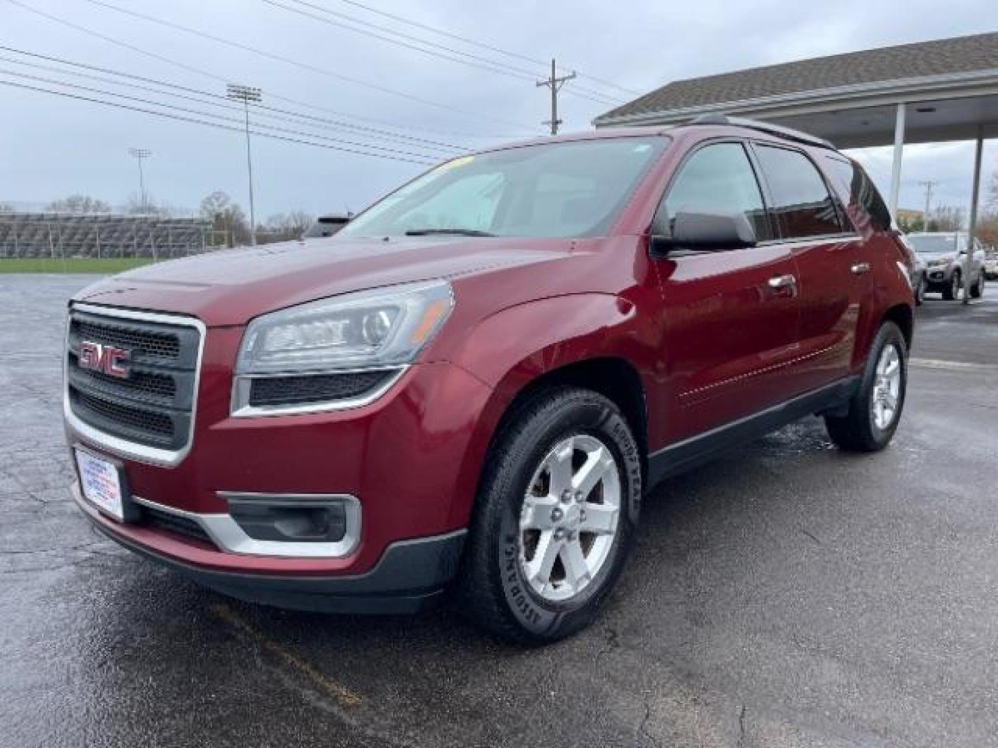 2015 Crimson Red Tincoat GMC Acadia SLE-2 AWD (1GKKVPKDXFJ) with an 3.6L V6 DOHC 24V engine, 6-Speed Automatic transmission, located at 1184 Kauffman Ave, Fairborn, OH, 45324, (937) 908-9800, 39.807365, -84.029114 - Photo#1