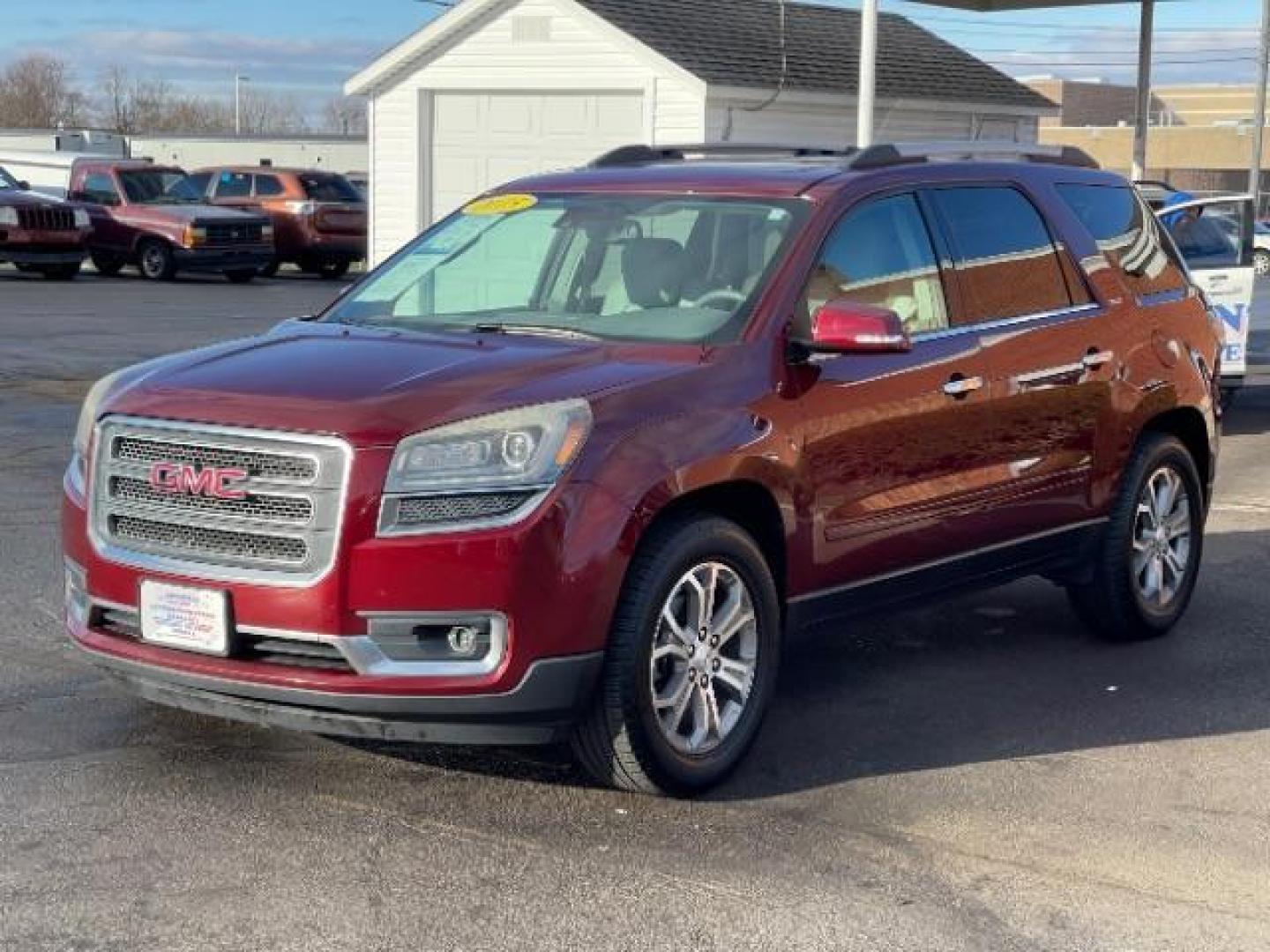 2015 Crimson Red Tincoat GMC Acadia SLT-1 FWD (1GKKRRKD7FJ) with an 3.6L V6 DOHC 24V engine, 6-Speed Automatic transmission, located at 880 E. National Road, Vandalia, OH, 45377, (937) 908-9800, 39.892189, -84.181015 - Photo#1